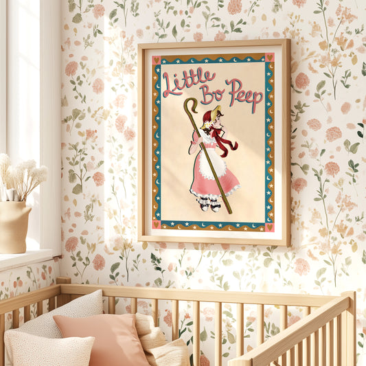 Framed 'Little Bo Peep' poster in a nursery with floral wallpaper and wooden crib.
