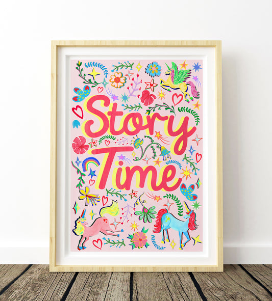 Colorful 'Story Time' poster with unicorns and flowers in a wooden frame on a white wall.