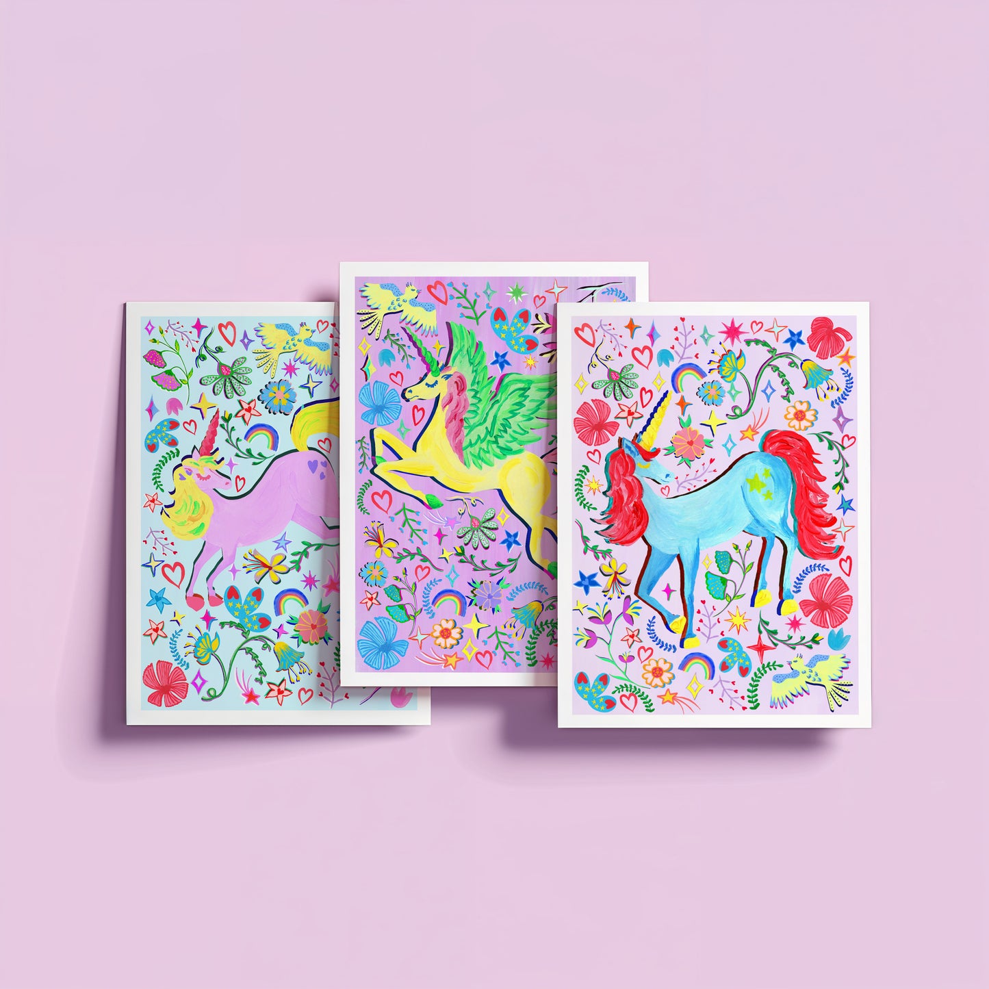 a colourful set of lilac unicorn paintings set against lilac background.