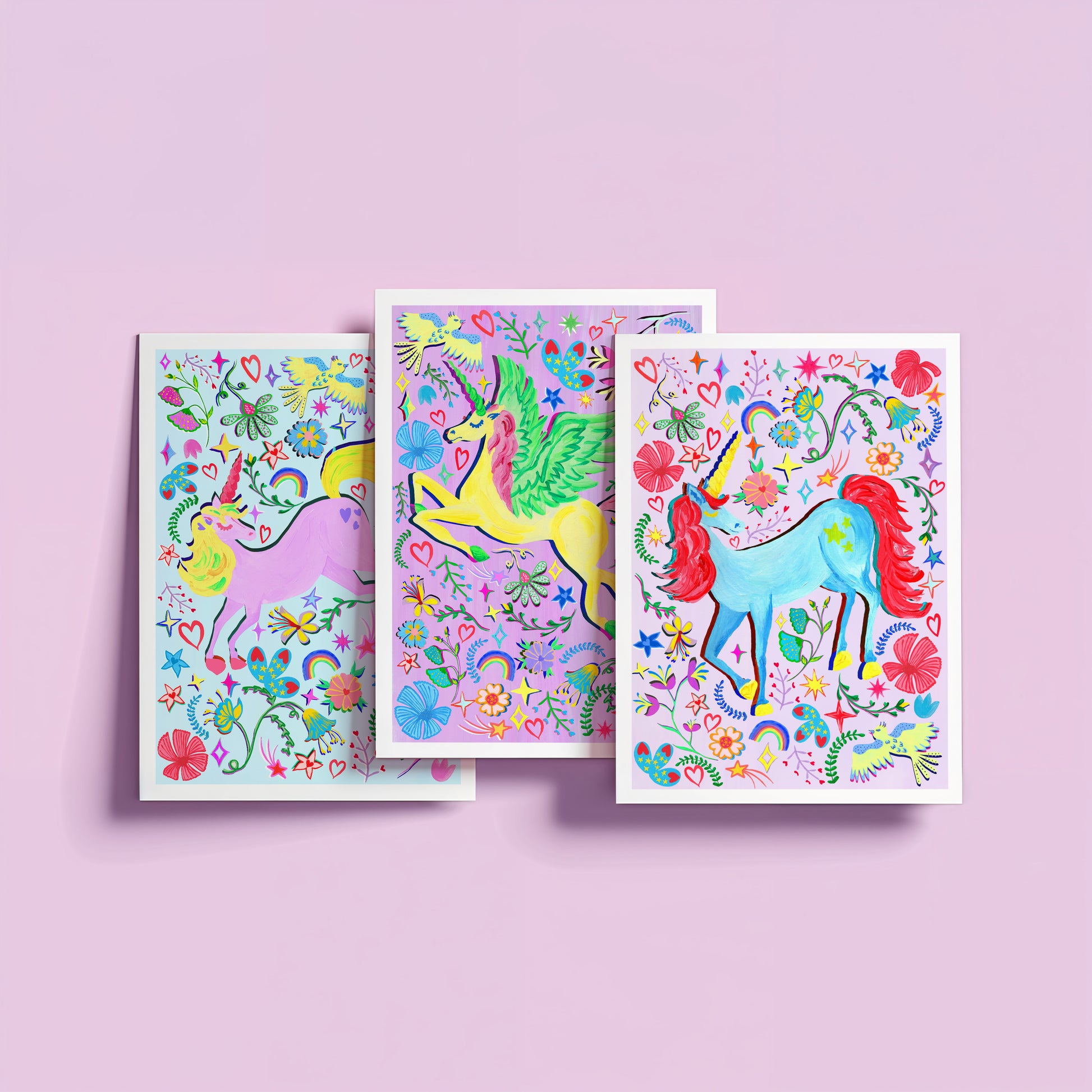 a colourful set of lilac unicorn paintings set against lilac background.