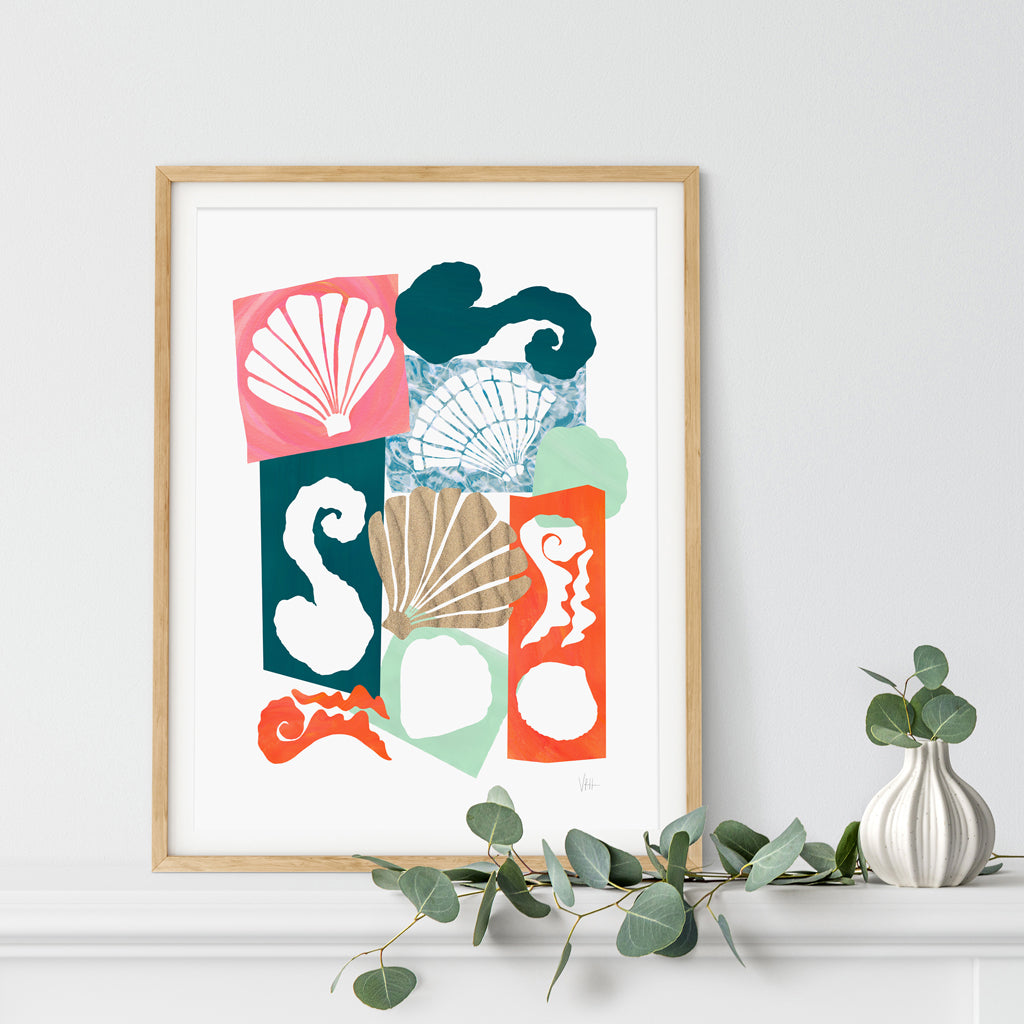 Framed abstract art print with colorful sea-themed design on a white wall.