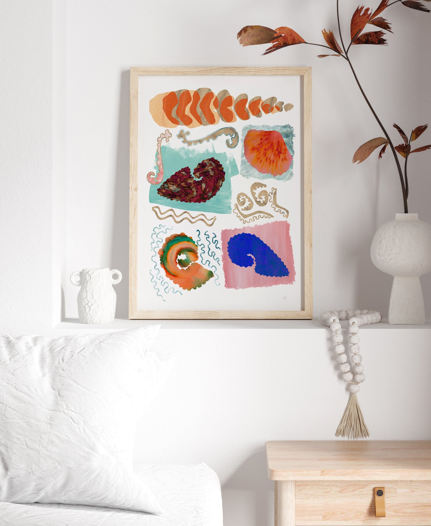 Colorful abstract art print on a wall in a living room setting.