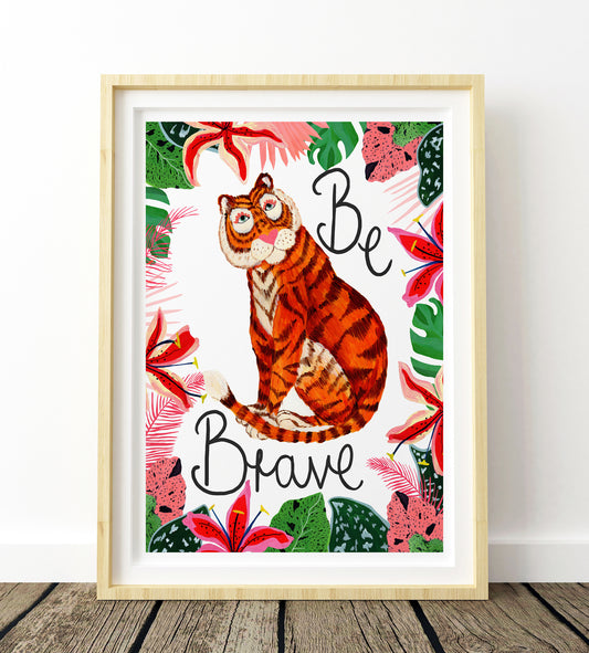 Framed artwork with a tiger illustration and 'Be Brave' text on a floral background.