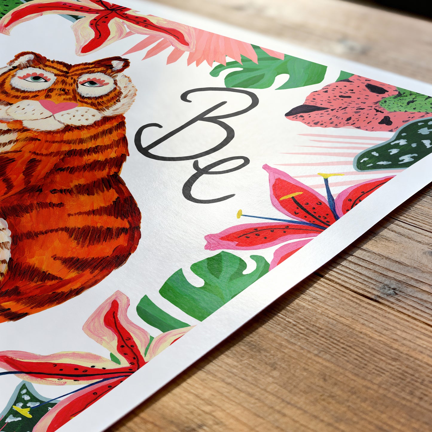 Colorful illustration of a tiger with floral elements on a wooden surface