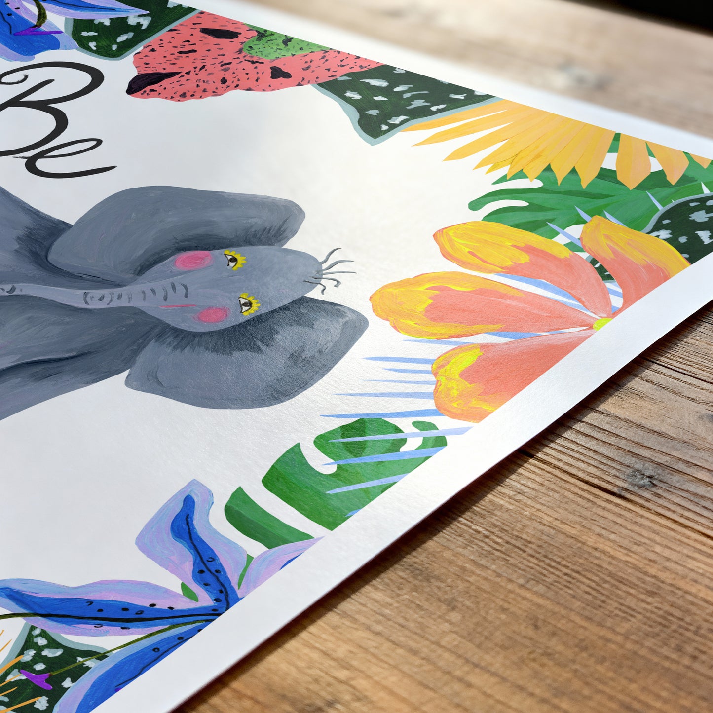 Colorful illustration of a elephant and flowers on a wooden surface