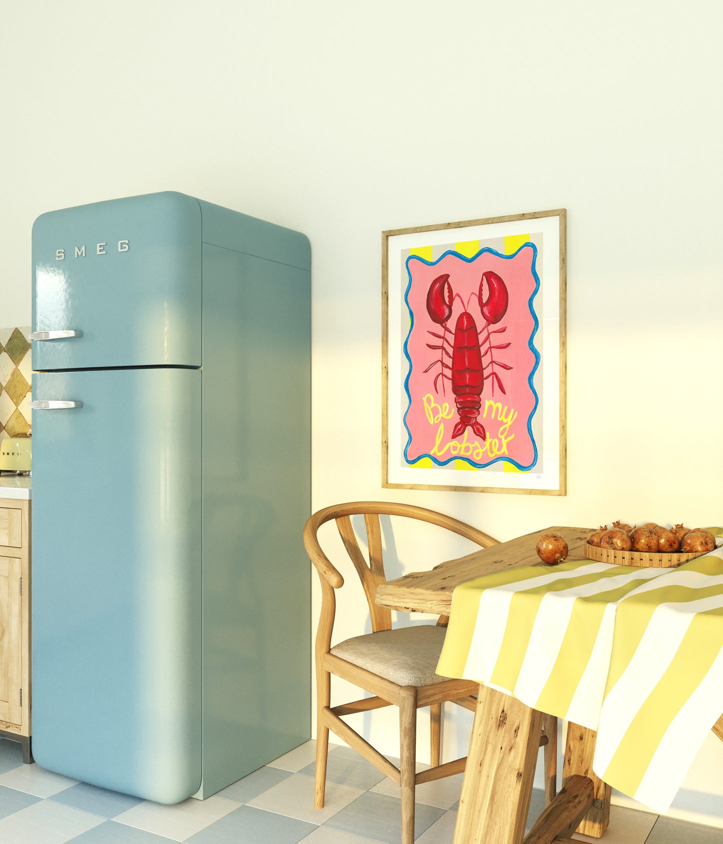 Vintage-style refrigerator in a kitchen with a table and colorful be my lobster print.