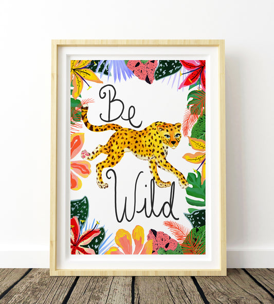 Framed artwork with a leopard and tropical leaves on a white background