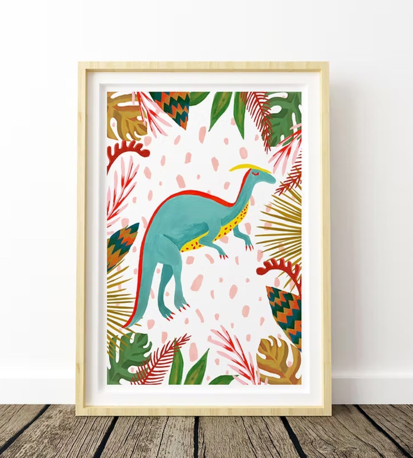 Framed colorful dinosaur illustration with tropical leaves on a white wall.