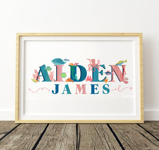 Framed children's name art with colorful letters and sea-themed characters on a white background.