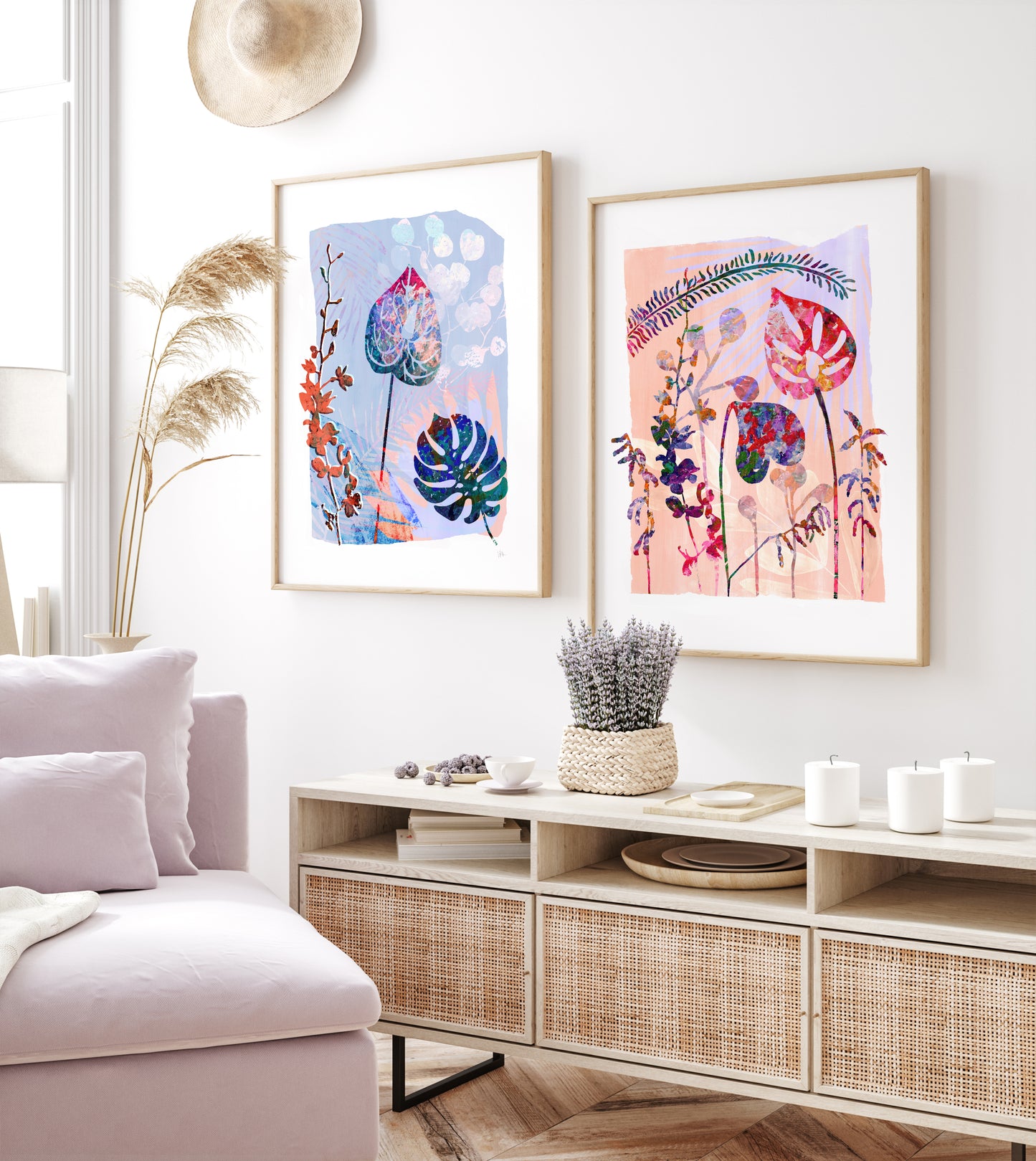 Living room with floral framed art on the wall, a white sofa, and a decorative cabinet.