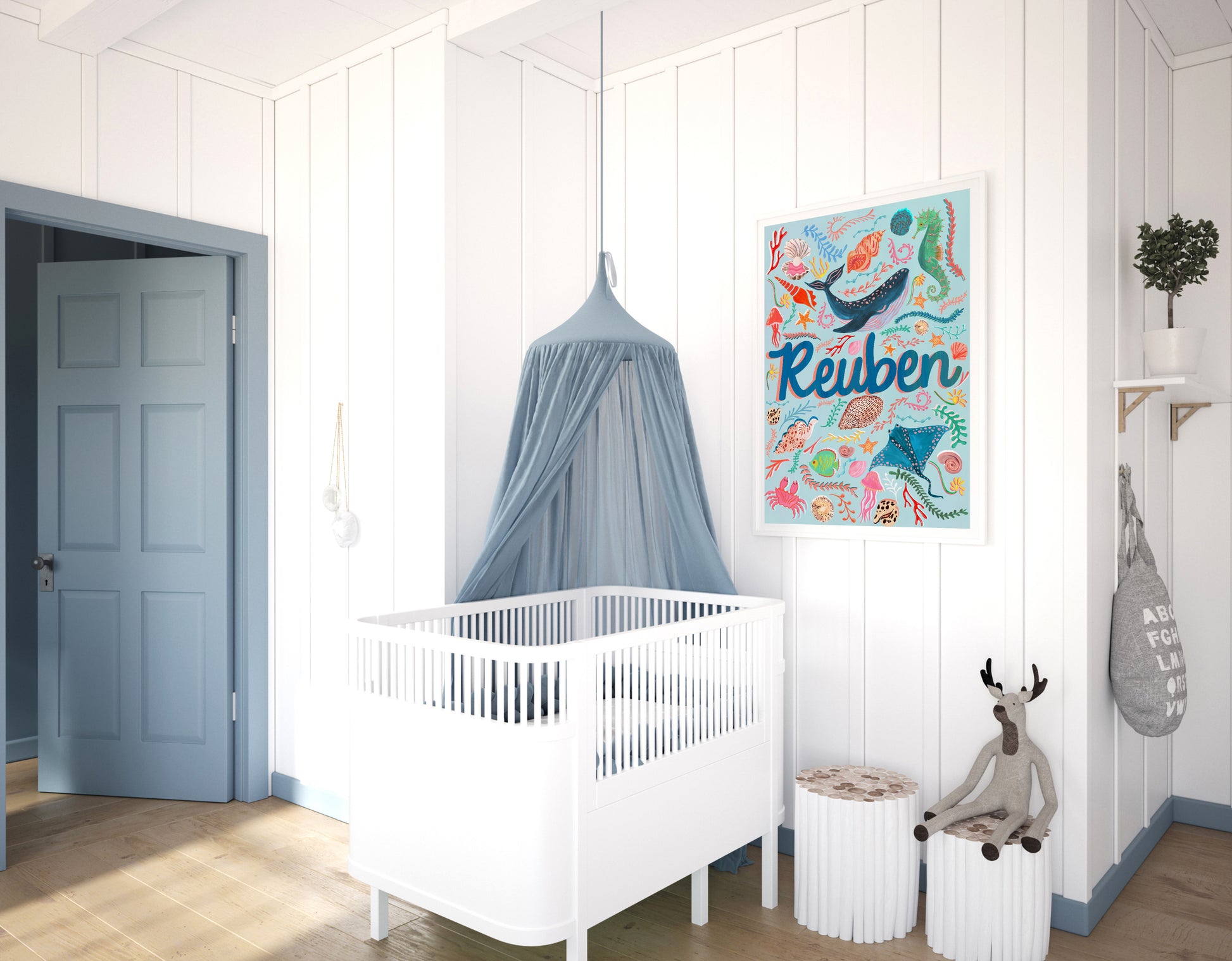 Nursery room with a crib, decorative wall art, and children's toys.