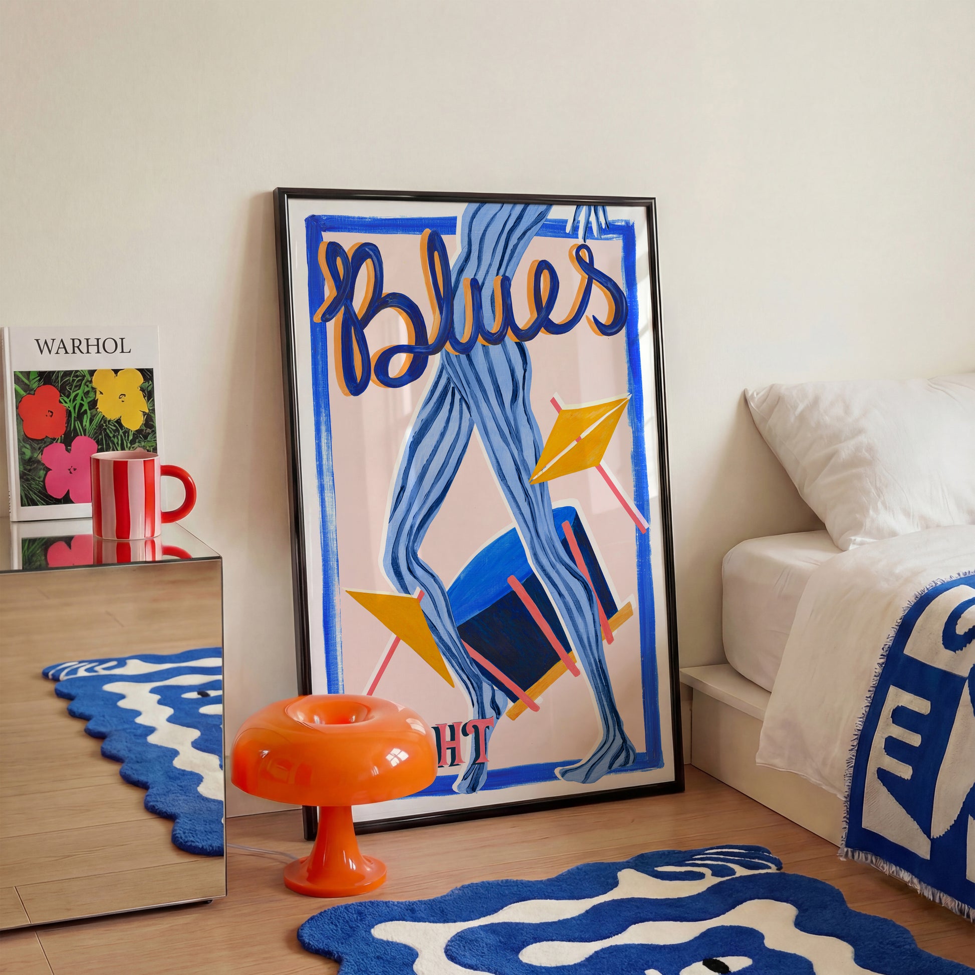 Blues Night Music poster in ablack fram in a bedroom setting