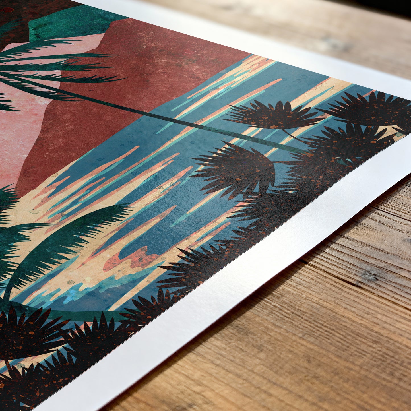 Art print with palm tree design on a wooden surface