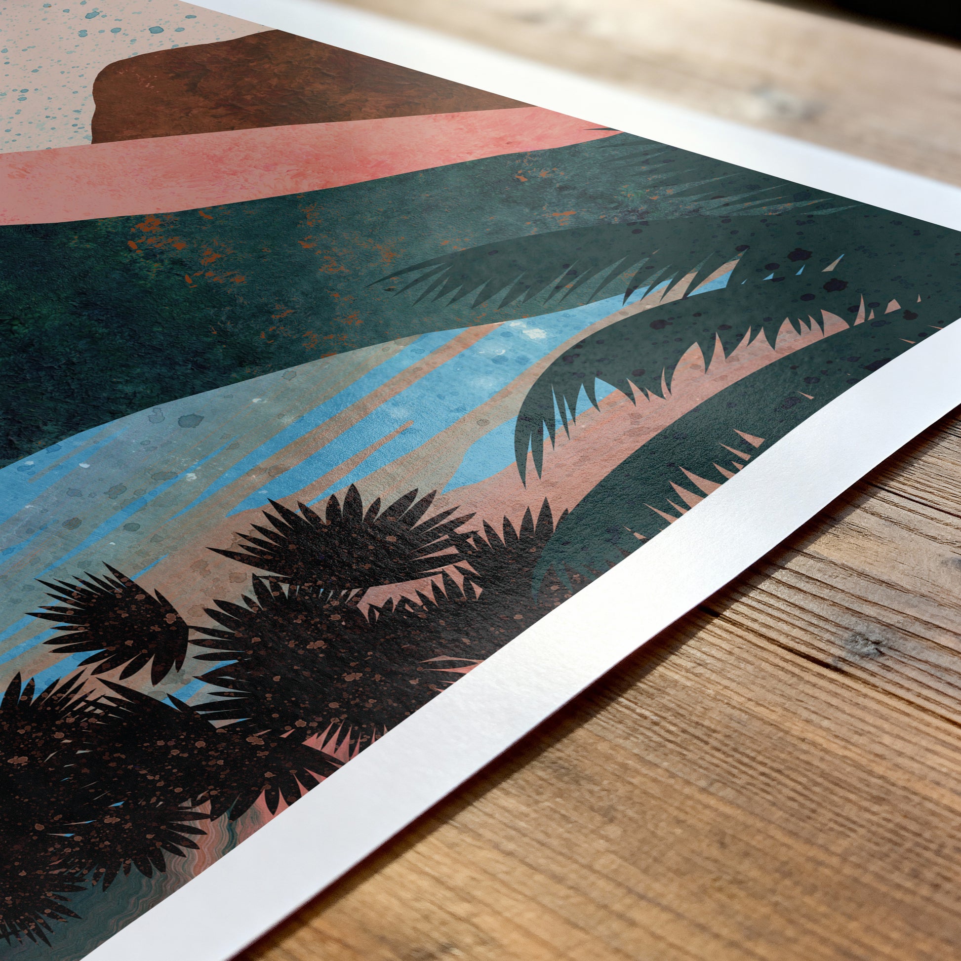 Art print with palm tree design on a wooden surface
