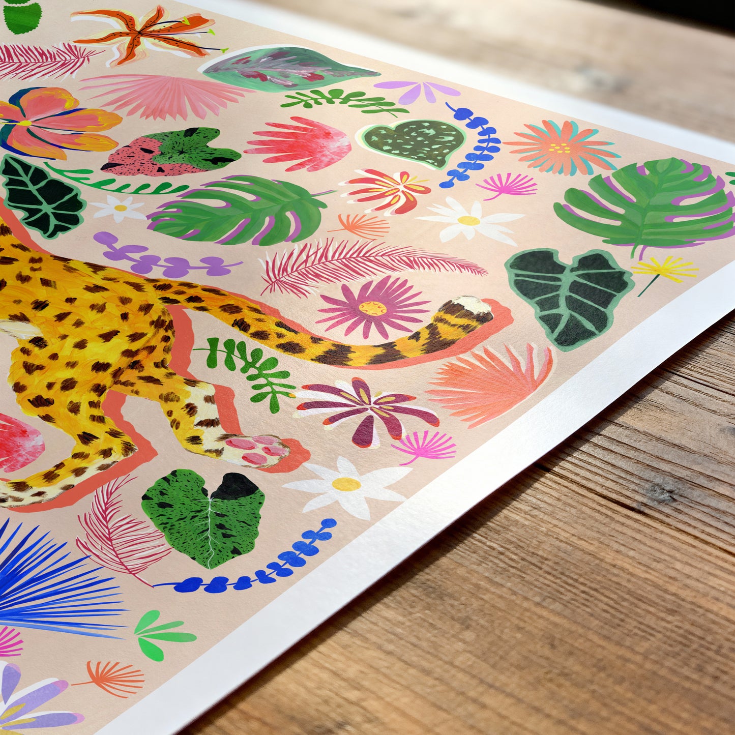 Colorful illustration of a leopard and tropical plants on a wooden surface
