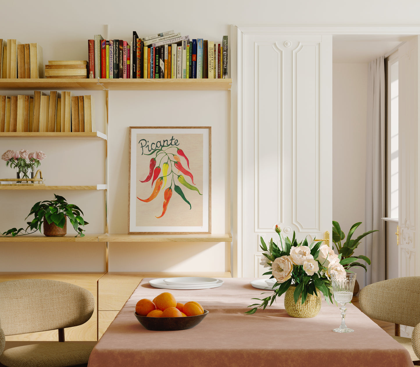 Dining room with a table set for a meal, books on a shelf, and a colorful painting on the wall.