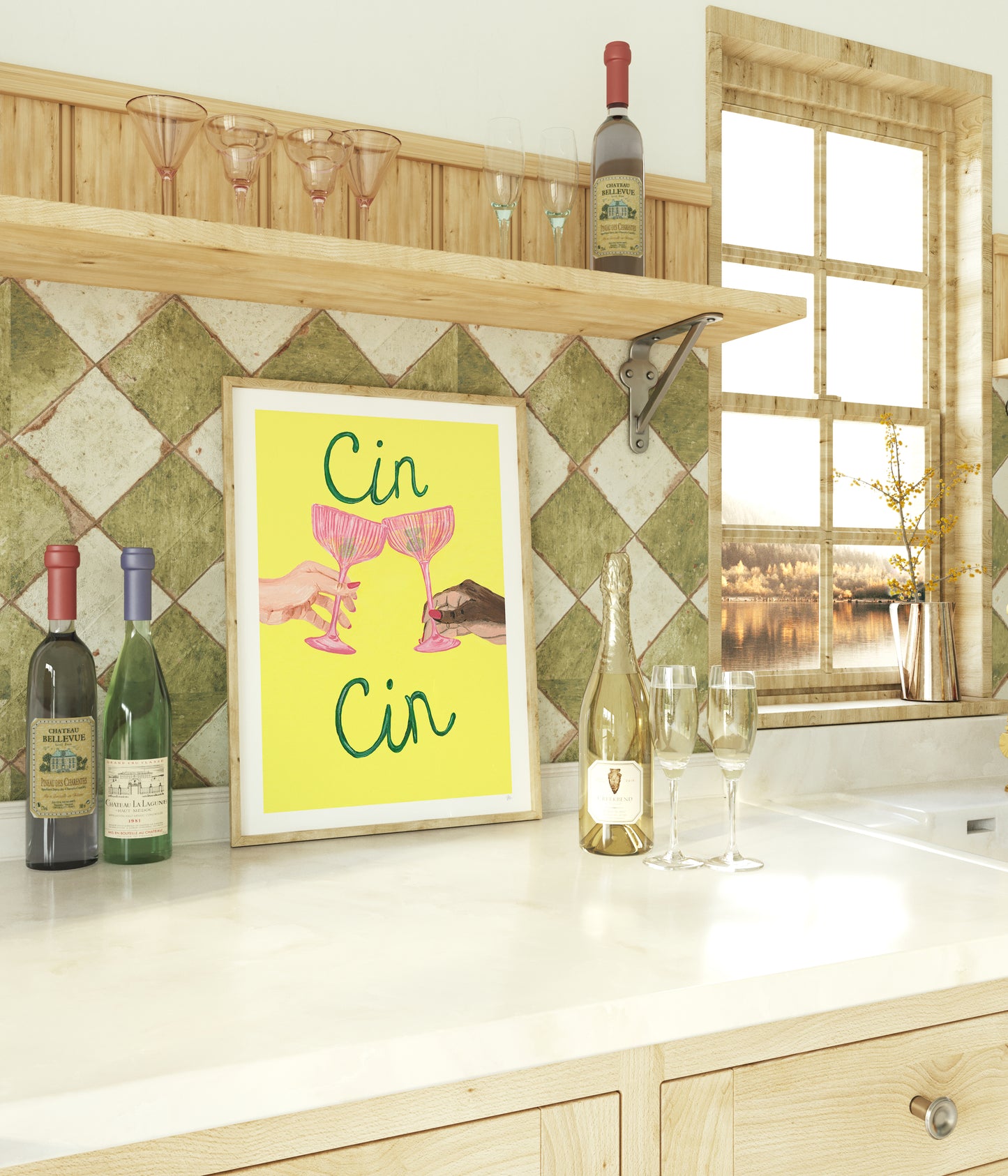 Kitchen counter with wine bottles, glasses, and a framed picture of two hands holding pink glasses with 'Cin Cin' text.