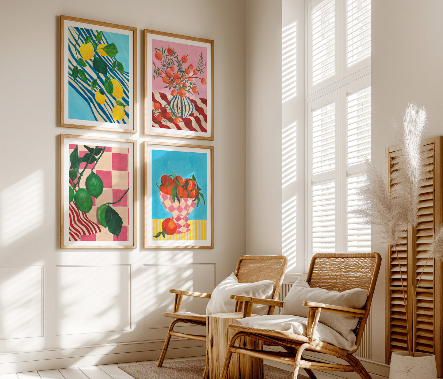 Colourful fruit artworks on a wall with wooden chairs and a radiator in a sunlit room.