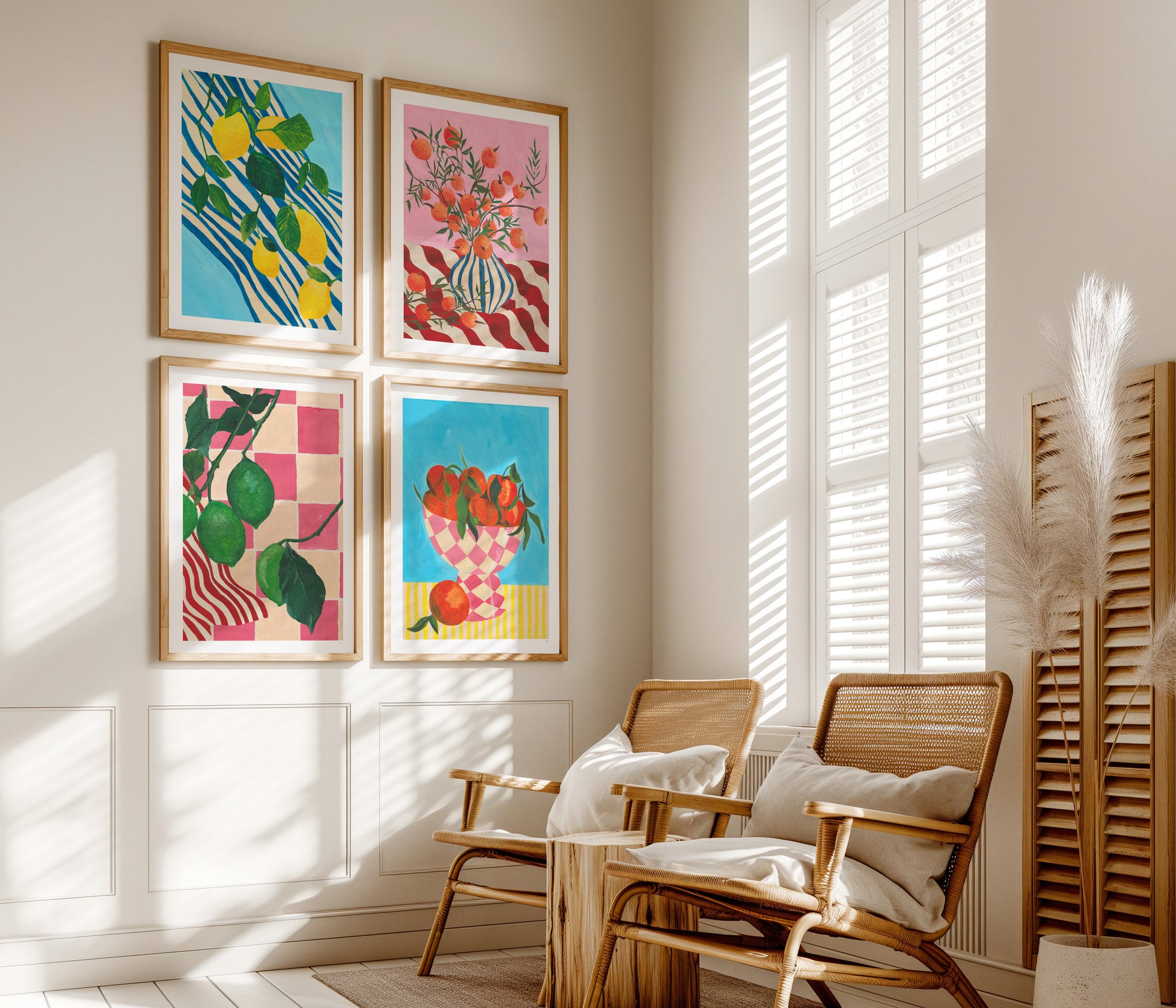 Colourful fruit artworks on a wall with wooden chairs and a radiator in a sunlit room.