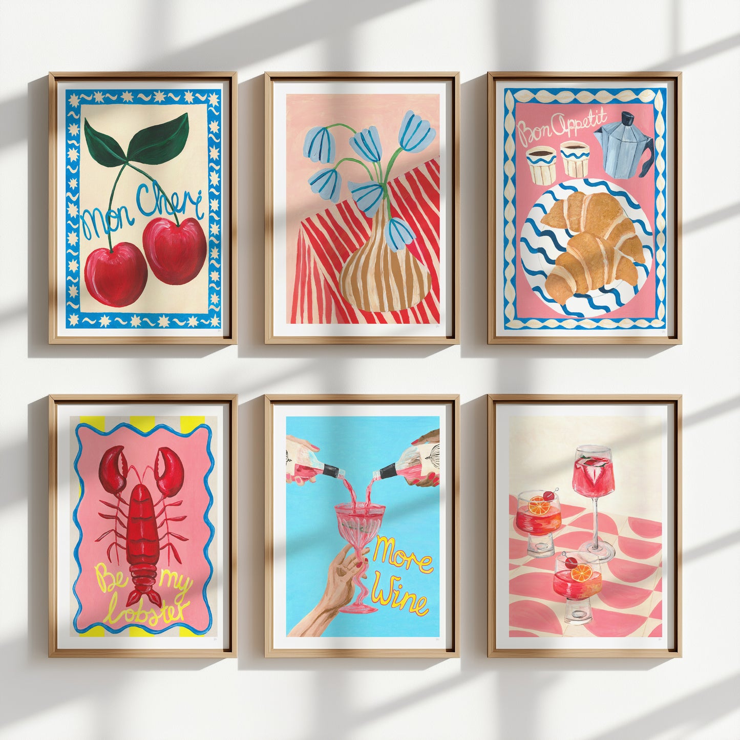 Set of six colorful framed artworks on a white wall