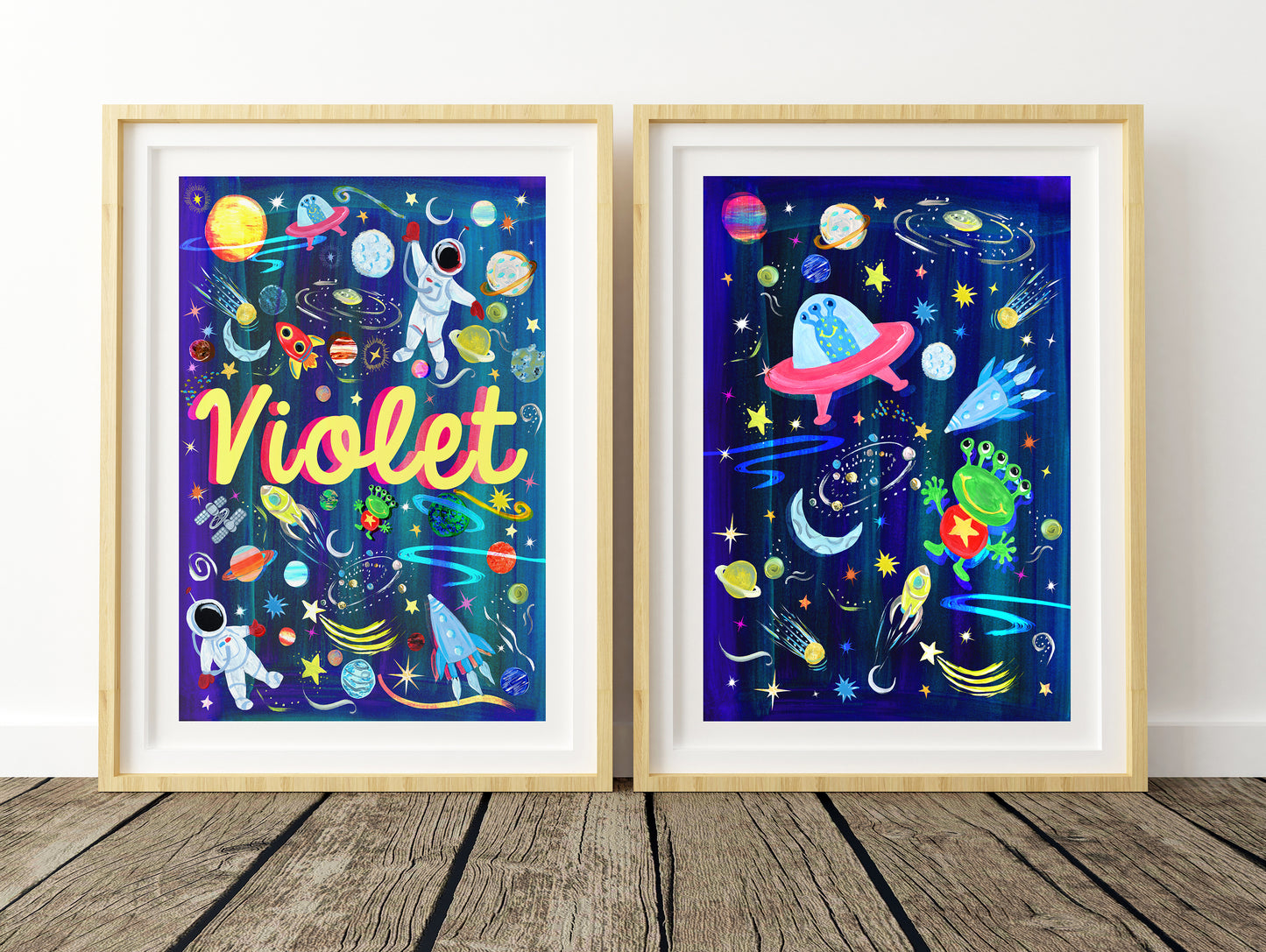 Two framed space-themed artworks with colorful illustrations and the name 'Violet'.