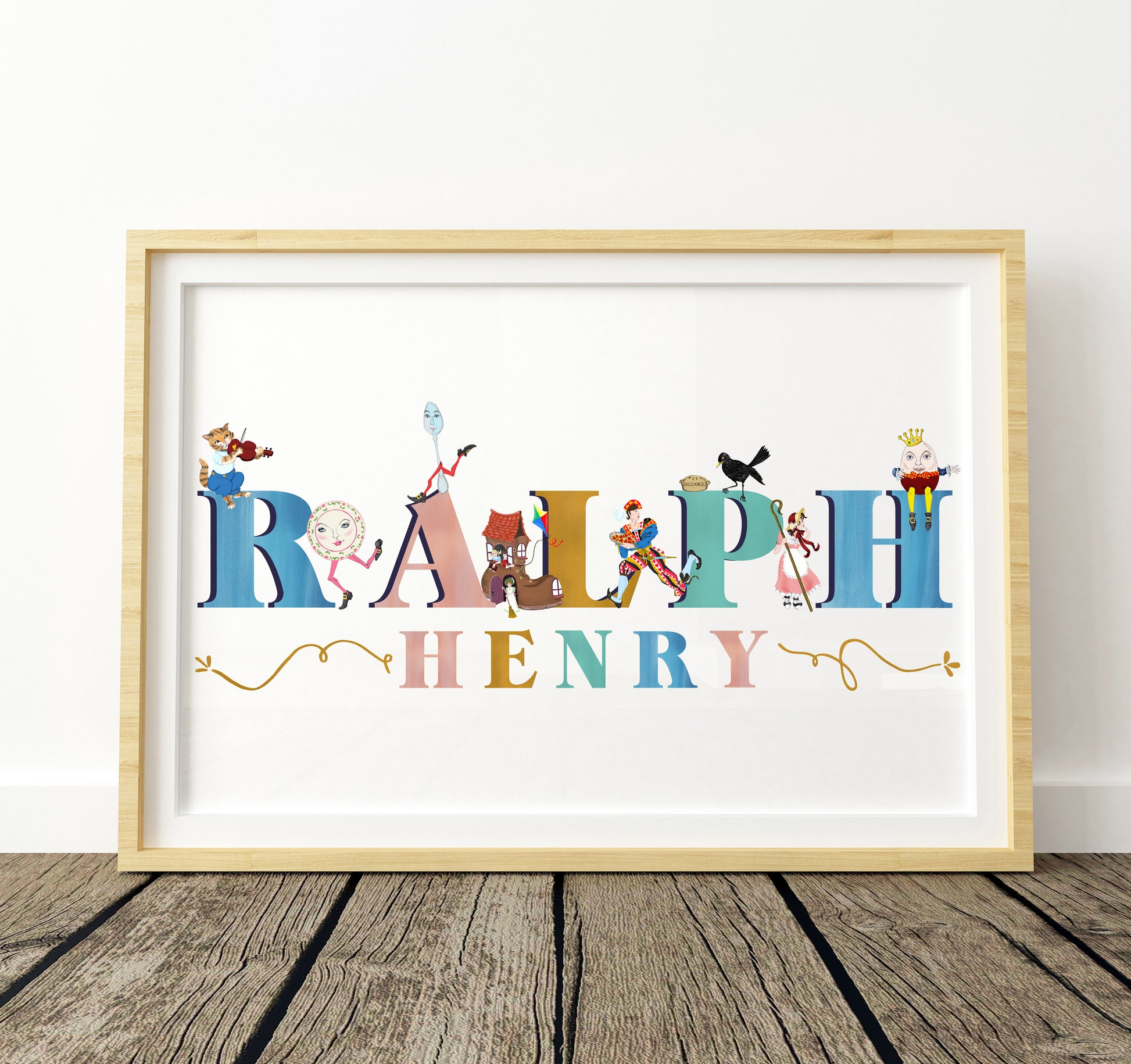 Framed artwork with colorful letters spelling 'RALPH HENRY' on a white background with nursery rhyme illustrations surrounding the letters.