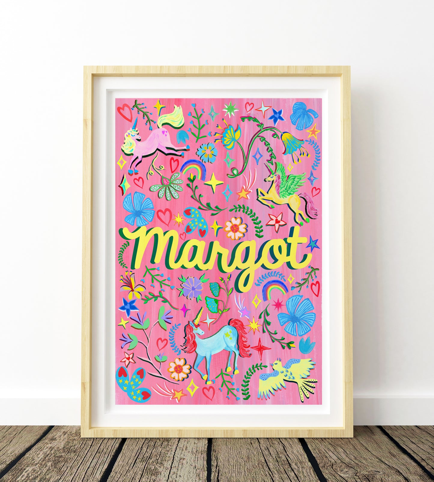 Colorful children's poster with 'Margot' on a pink background, framed in wooden frame.