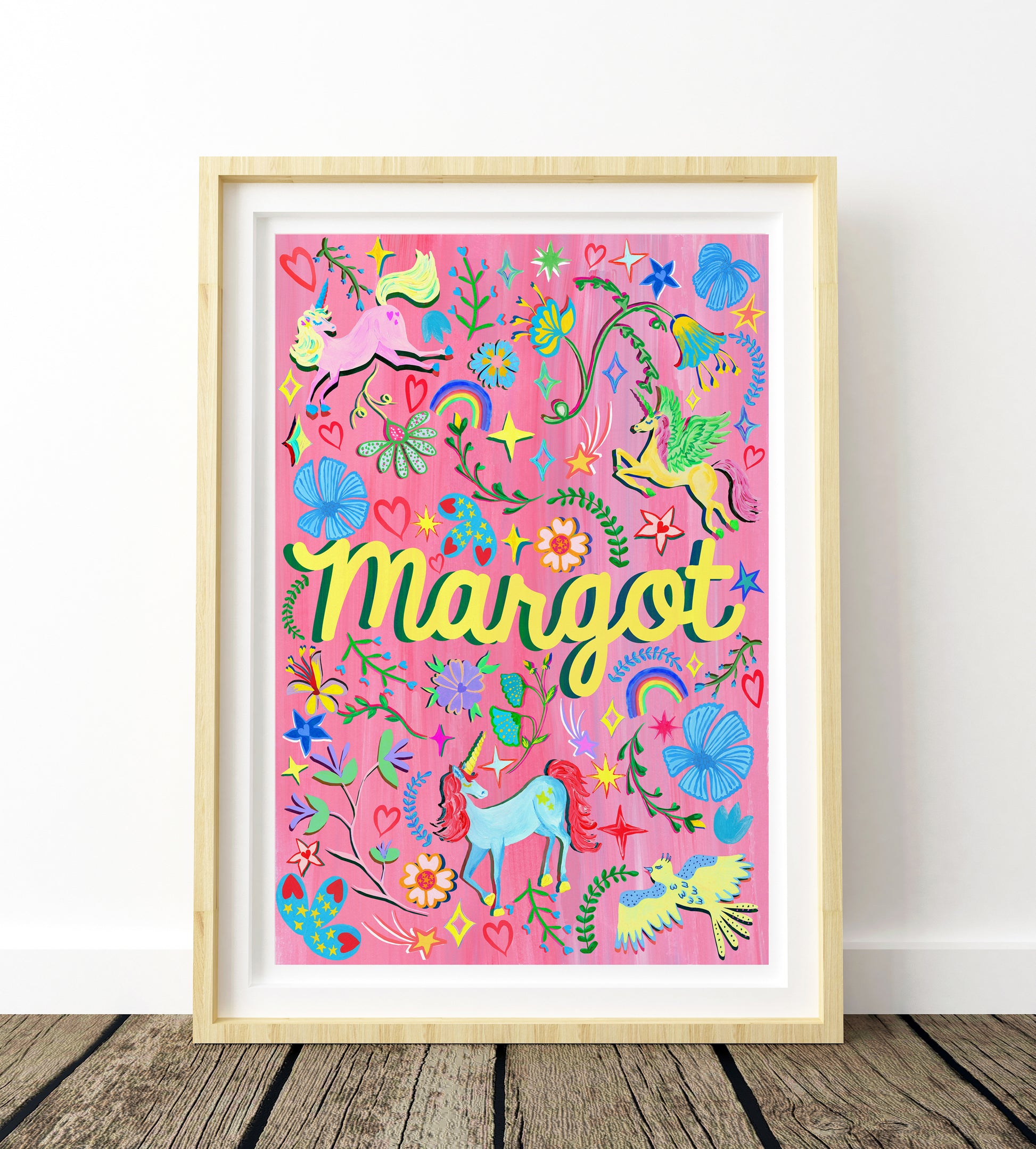 Colorful children's poster with 'Margot' on a pink background, framed in wooden frame.