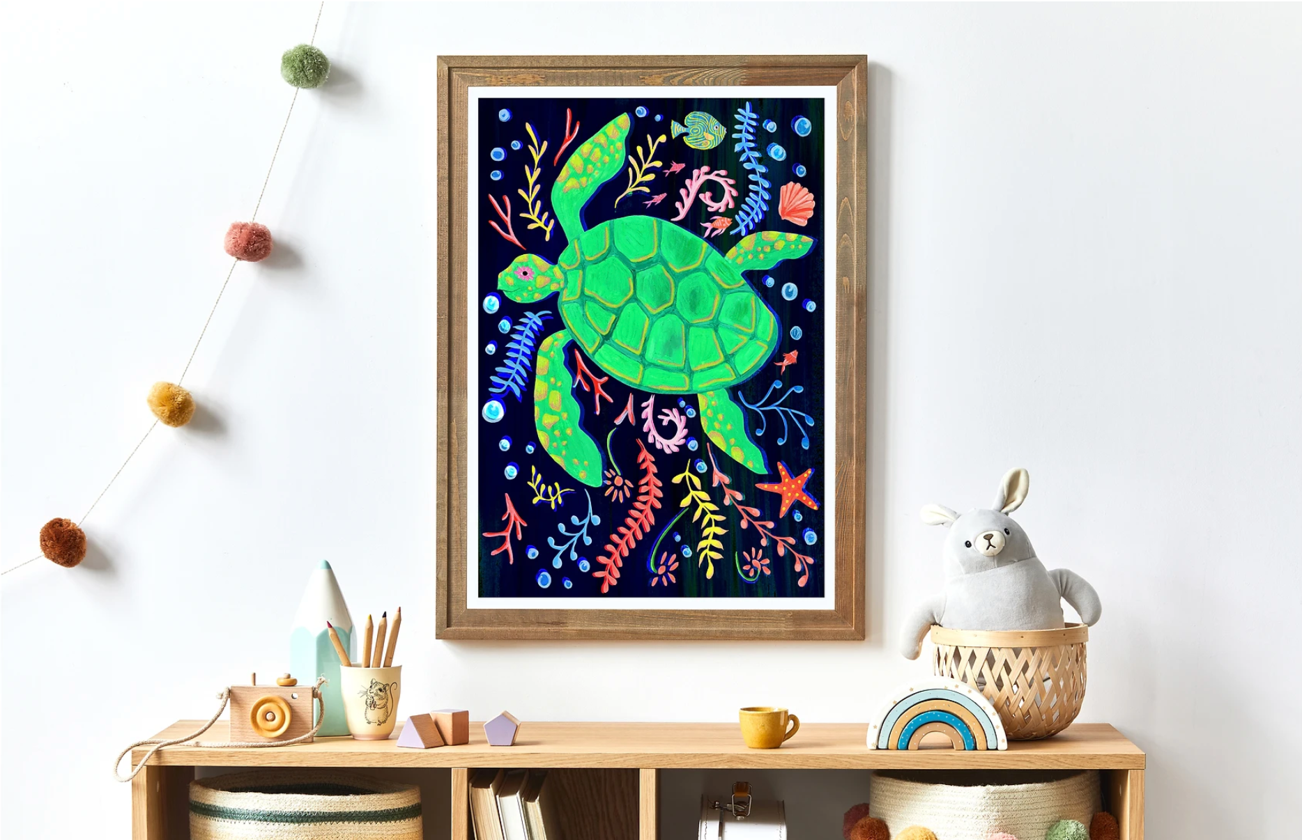 Framed artwork of a colorful turtle on a wall above a wooden shelf with decor items.