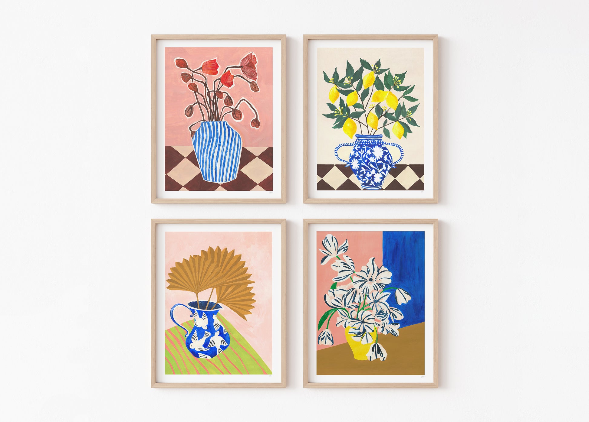 Four framed artworks with floral and vase designs on a white background