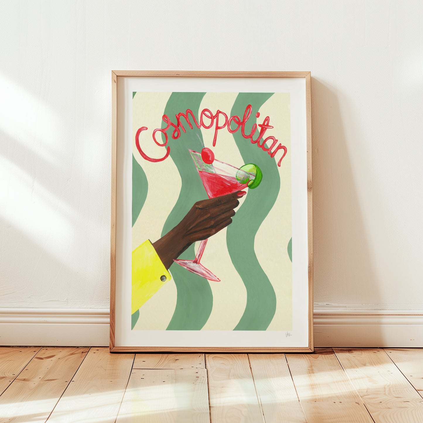 Framed artwork of a hand holding a Cosmopolitan cocktail with wavy green and beige background.