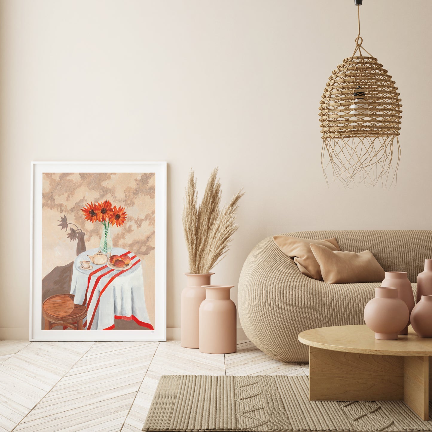 Modern living room with a beige sofa, decorative vases, and a framed artwork on a wall.