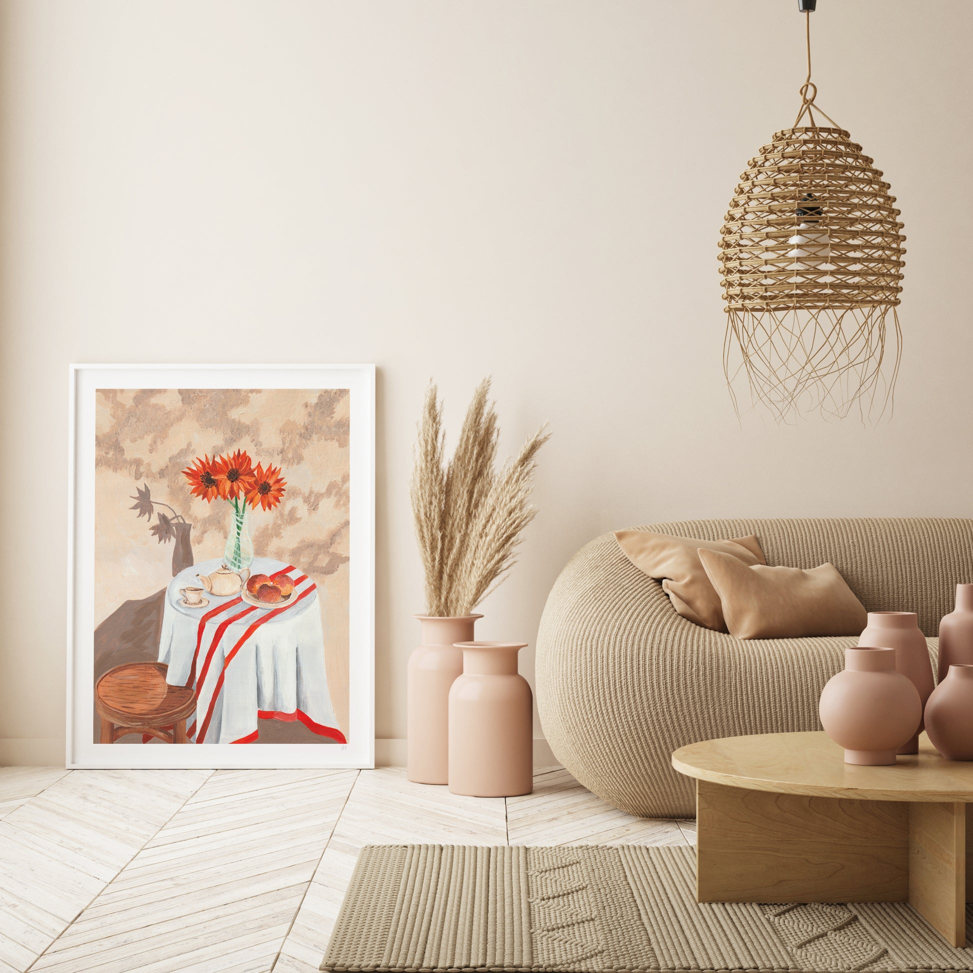 Modern living room with a beige sofa, decorative vases, and a framed artwork on a wall.
