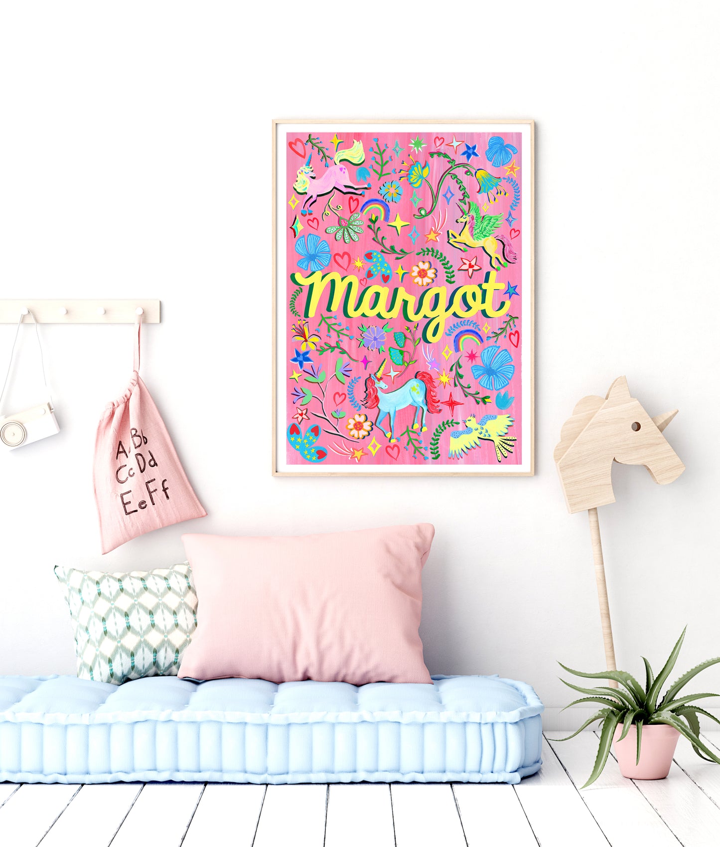 Children's room with colorful wall art, pink pillow, and decorative items.