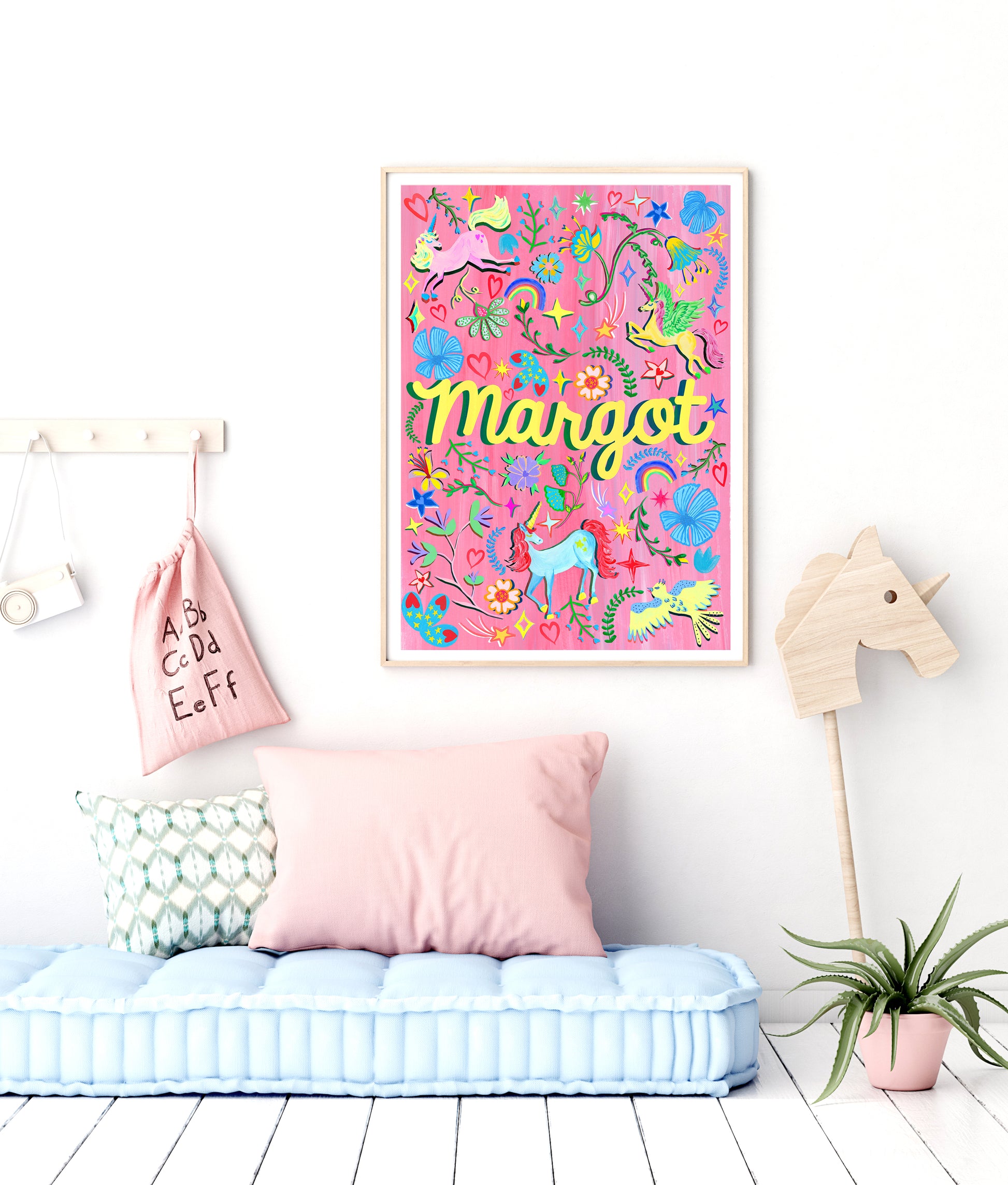 Children's room with colorful wall art, pink pillow, and decorative items.