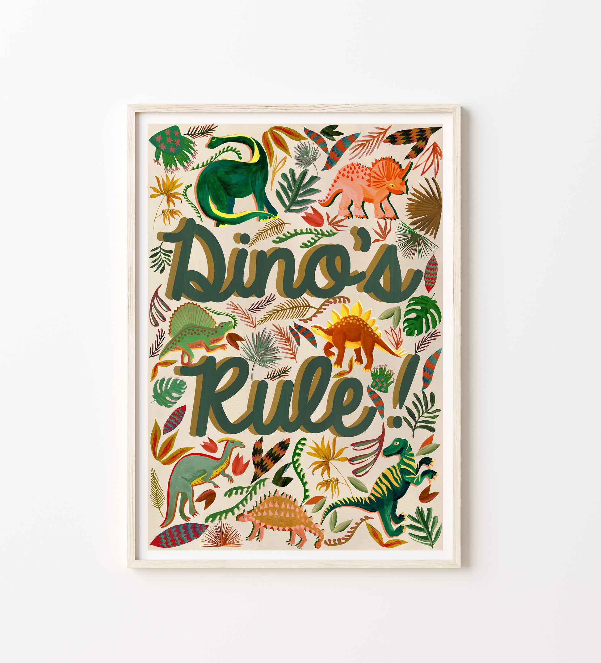Framed artwork with colorful dinosaurs and the text 'Dino's Rule!' on a white background