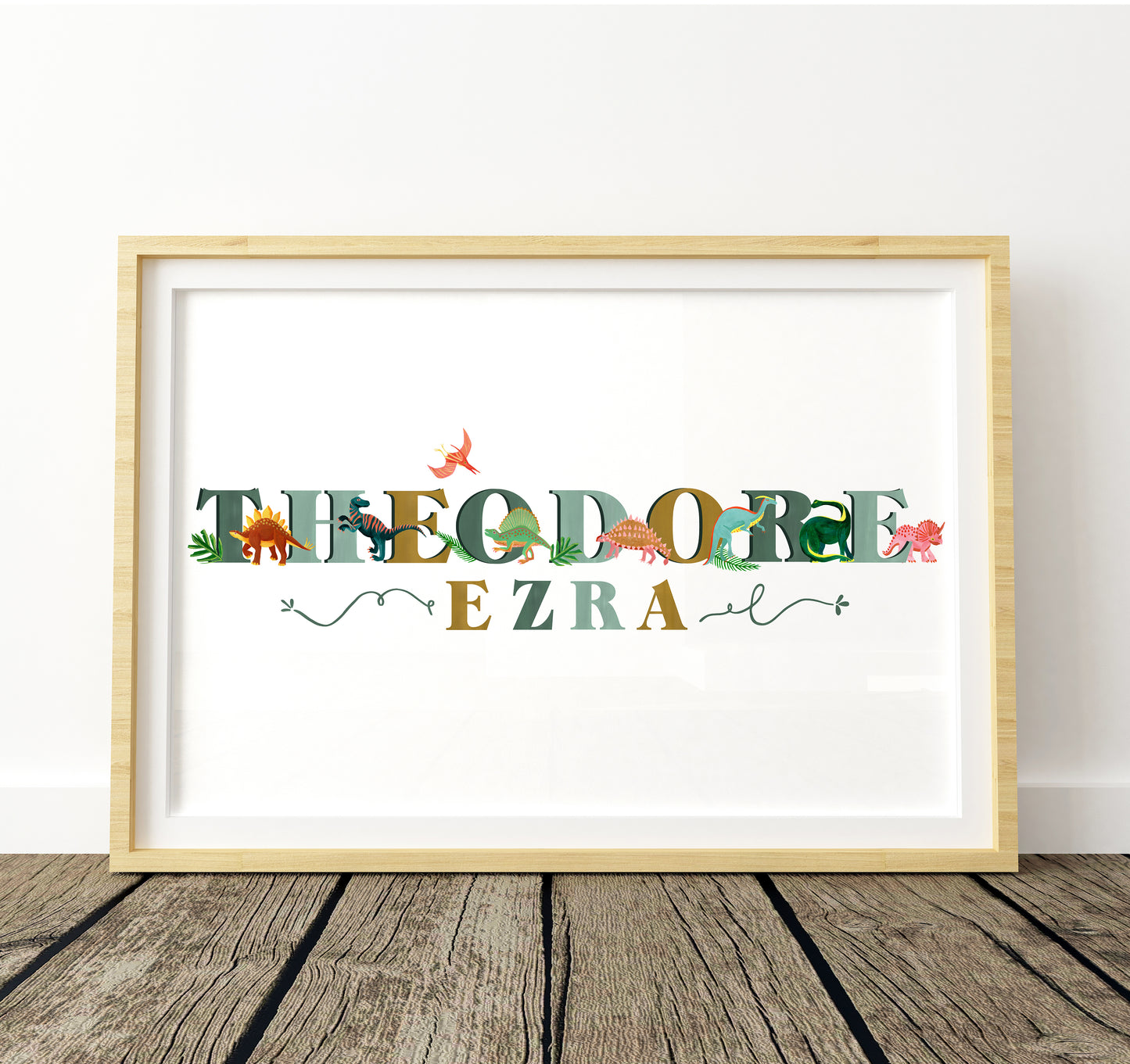 Framed artwork with colorful text and dinosaur illustrations on a white background