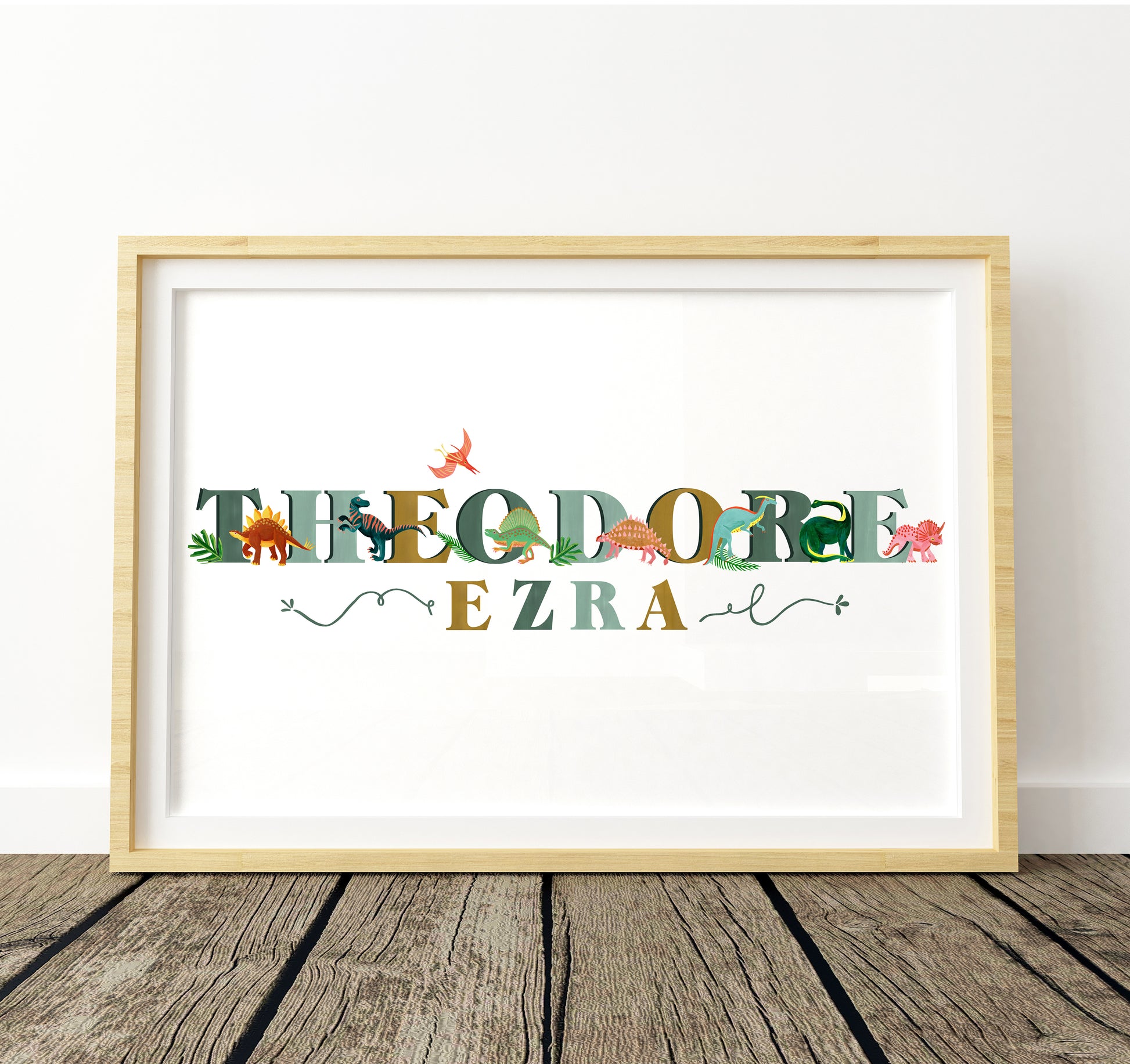 Framed artwork with colorful text and dinosaur illustrations on a white background