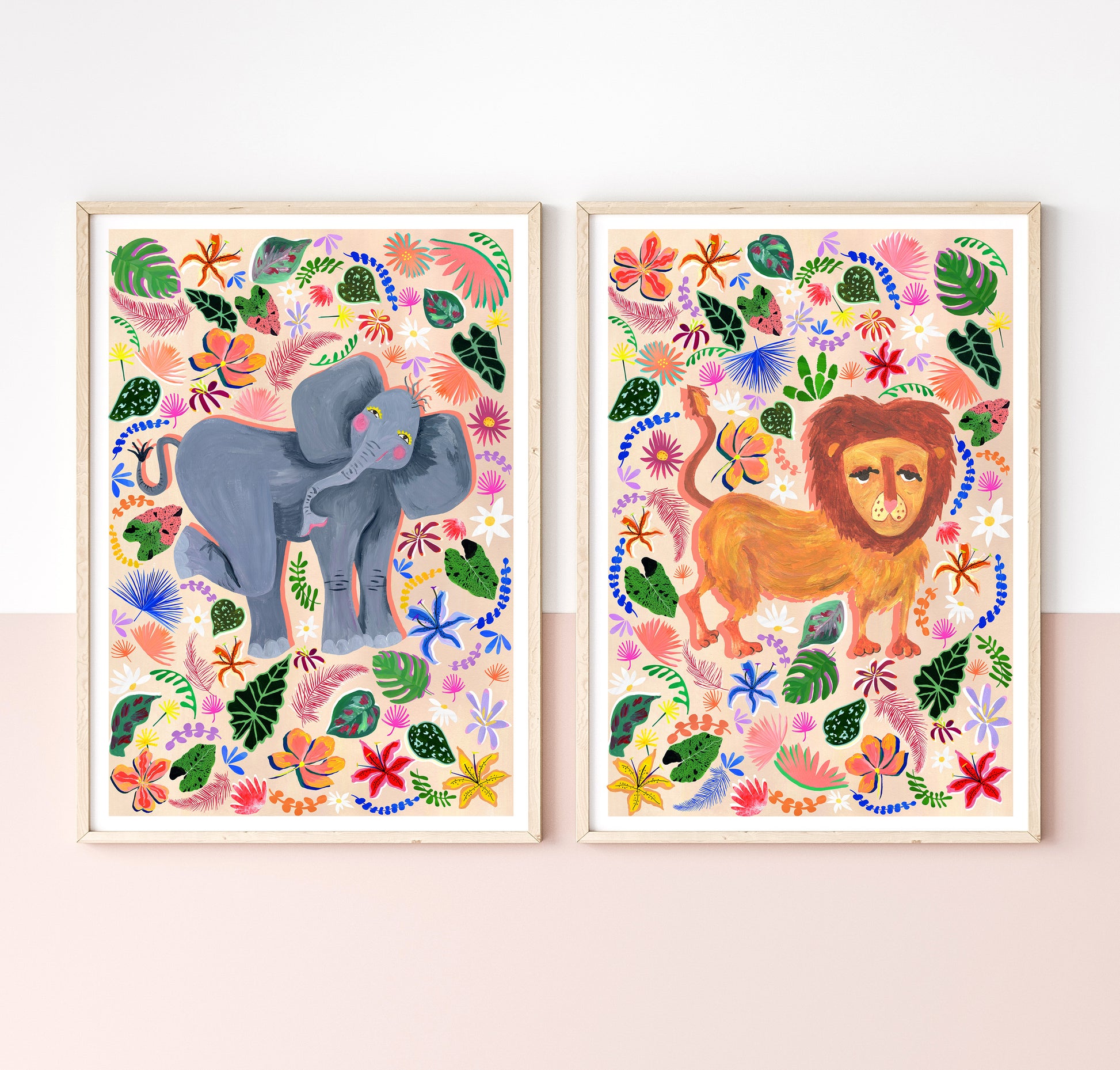 Two colorful animal prints of an elephant and a lion on a white wall.