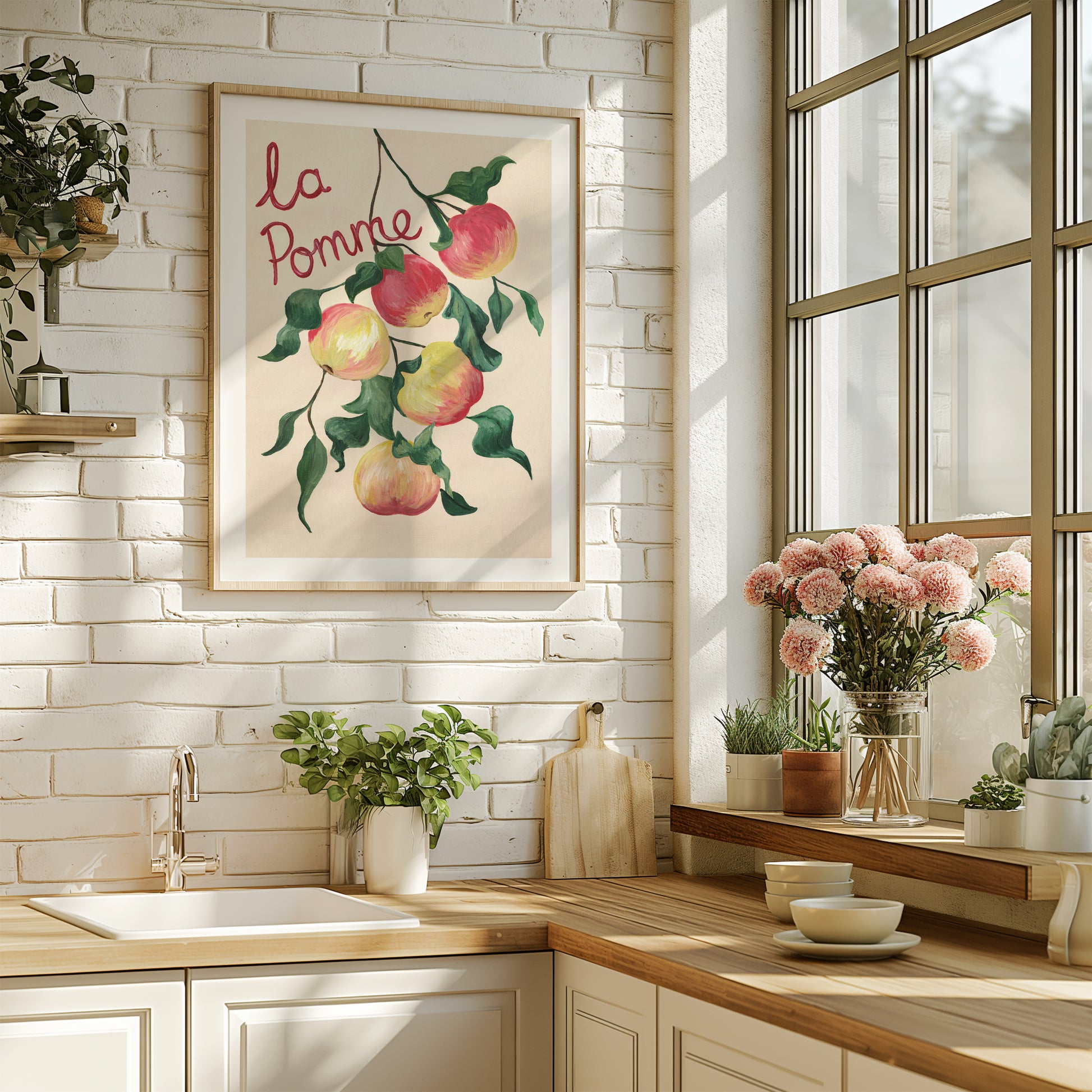 Modern kitchen with a decorative apple-themed painting on the wall.