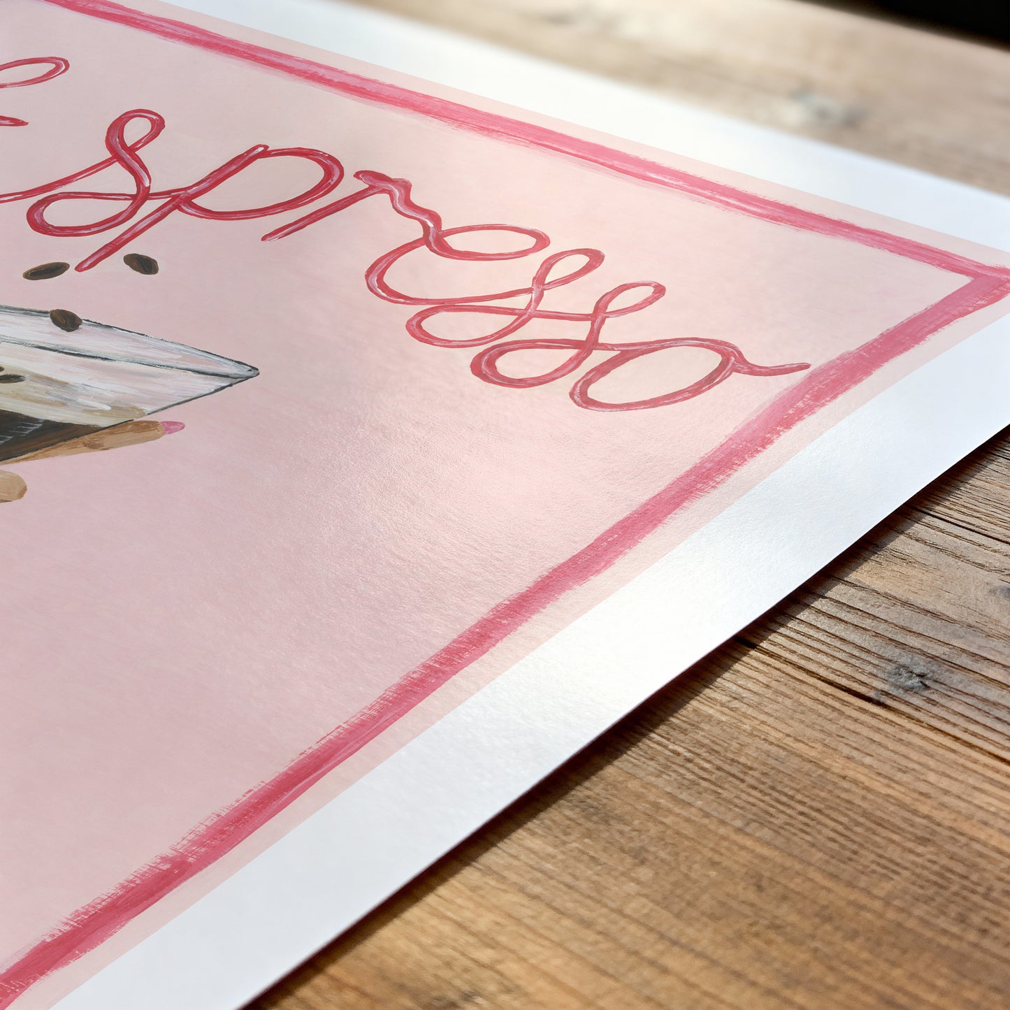 Poster with 'Espresso martini' text and cocktail illustration on a wooden surface