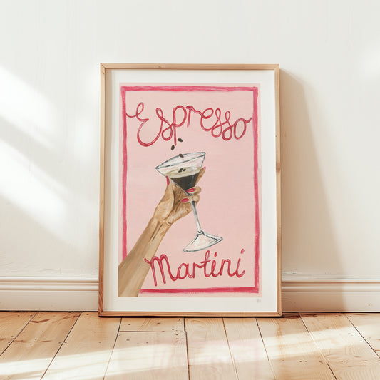 Framed artwork with a hand holding a cocktail and 'Espresso Martini' text on a pink background.