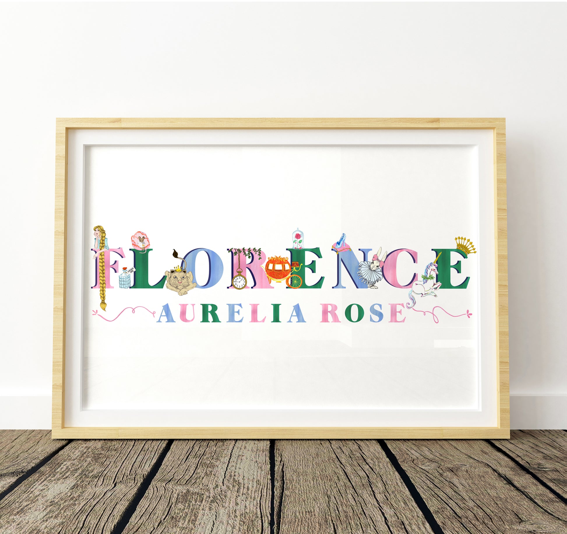 Framed artwork with colorful letters spelling 'FLORENCE AURELIA ROSE' with fairytale illustrations decorating the letters on a white background.