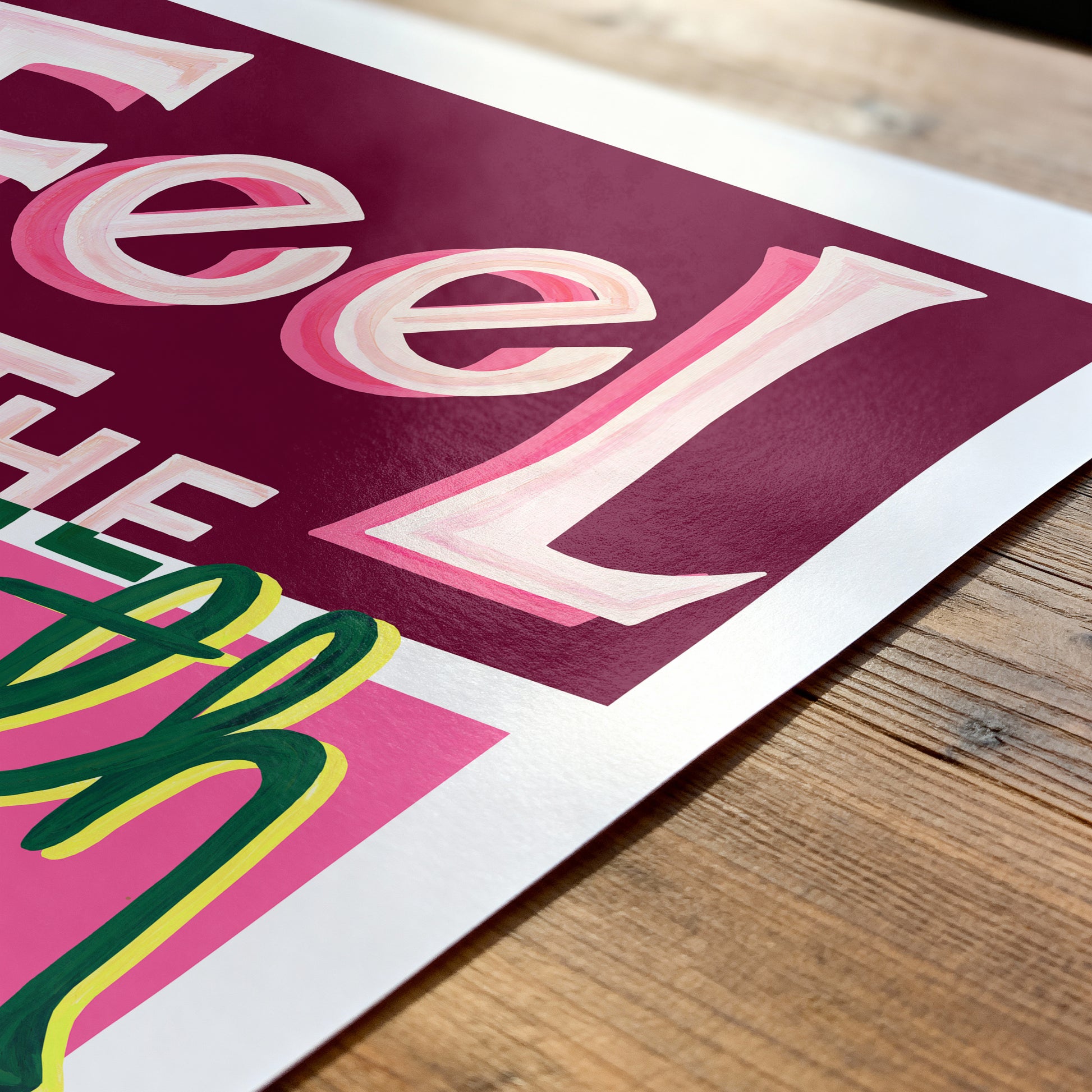 Colorful text poster on a wooden surface
