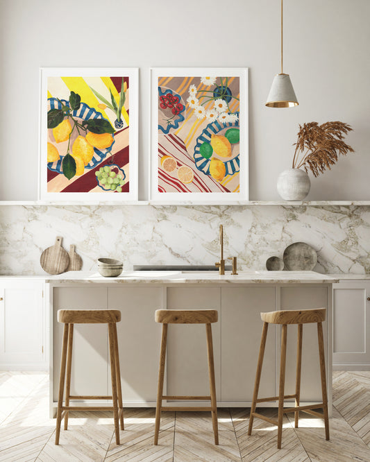 Modern kitchen with marble countertop, wooden stools, and colorful wall art.