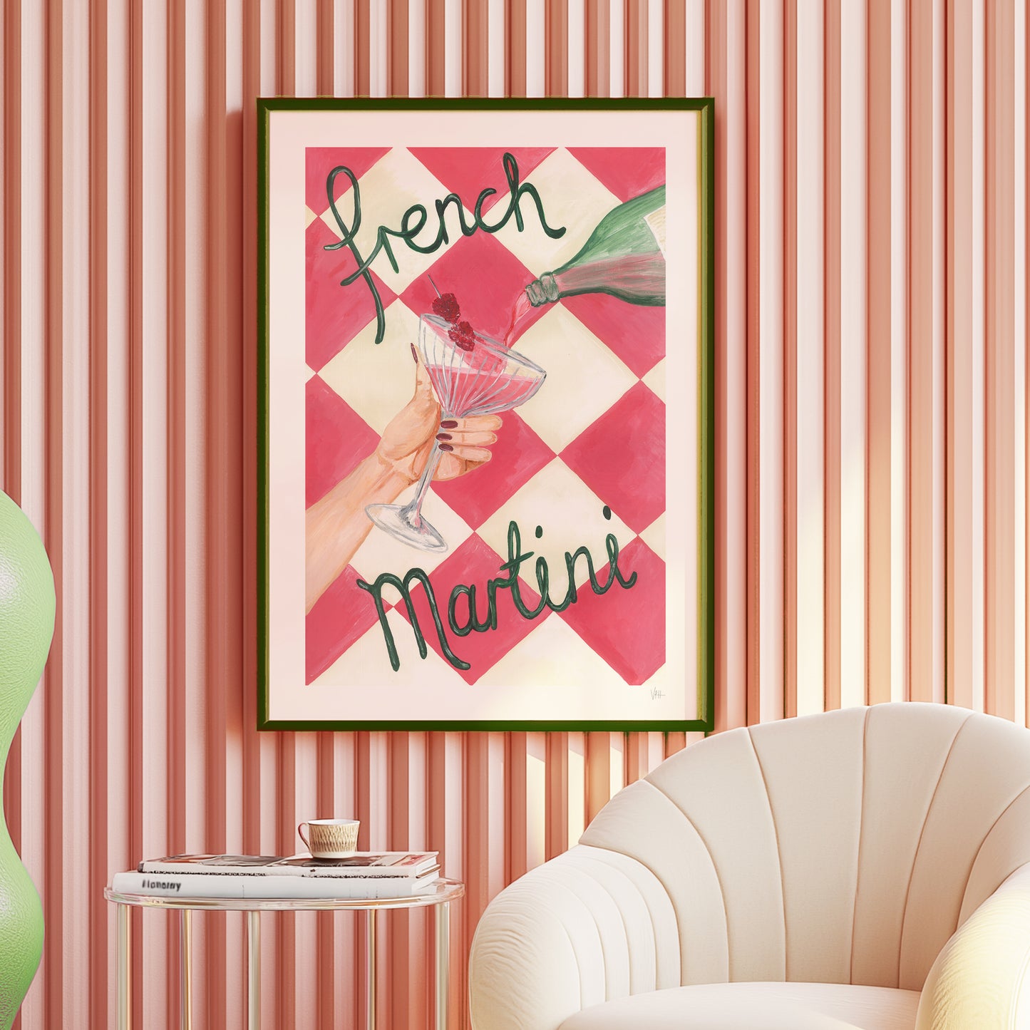 Framed artwork with 'French Martini' text on a checkered background, displayed in a room with striped walls and a chair.