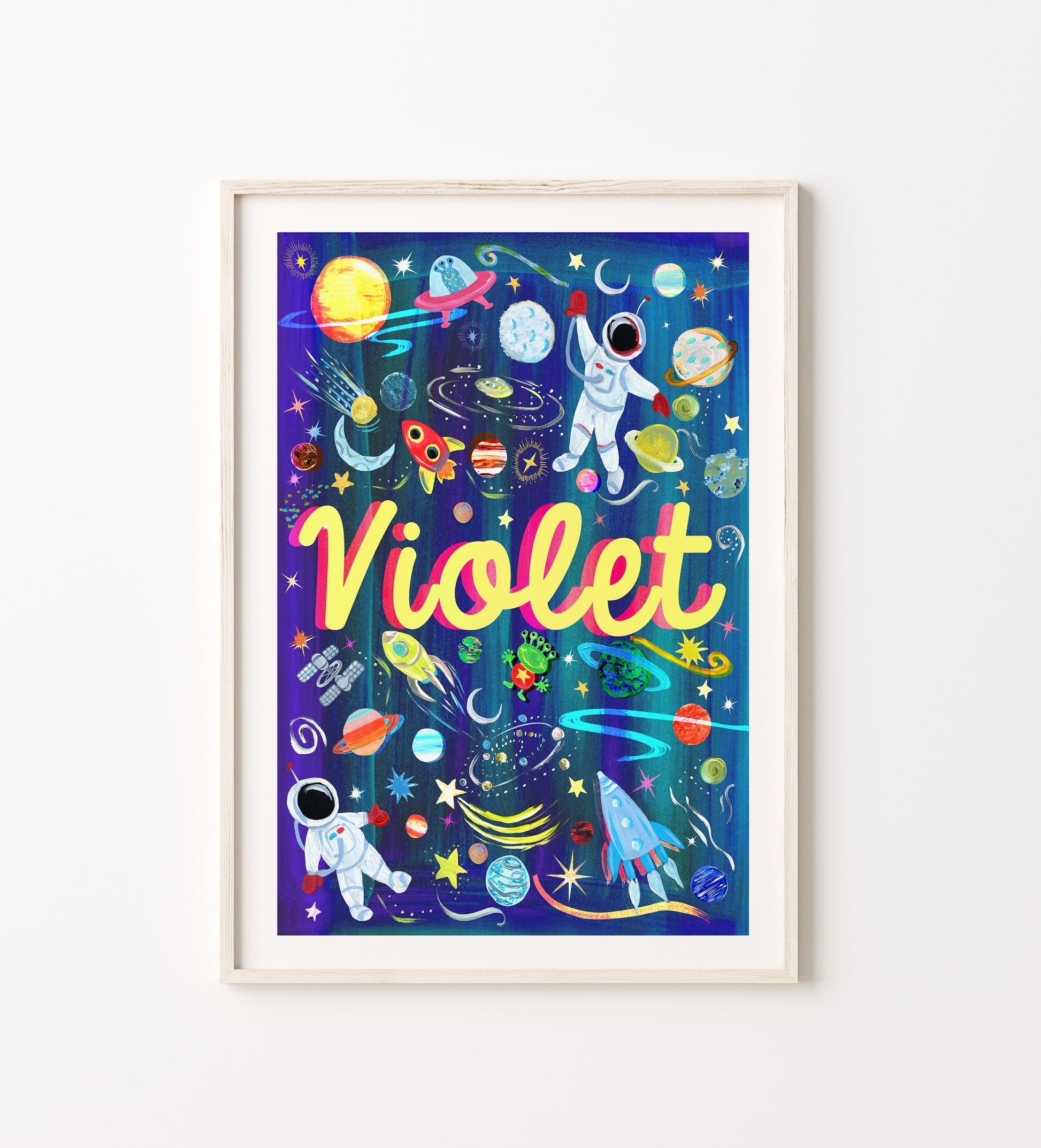 Framed artwork with space-themed design and the name 'Violet' on a white background