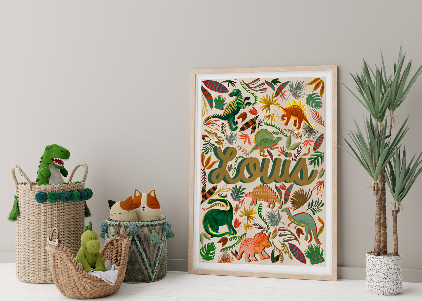 Framed artwork with 'Louis' and dinosaur illustrations, placed on a shelf with decorative items.