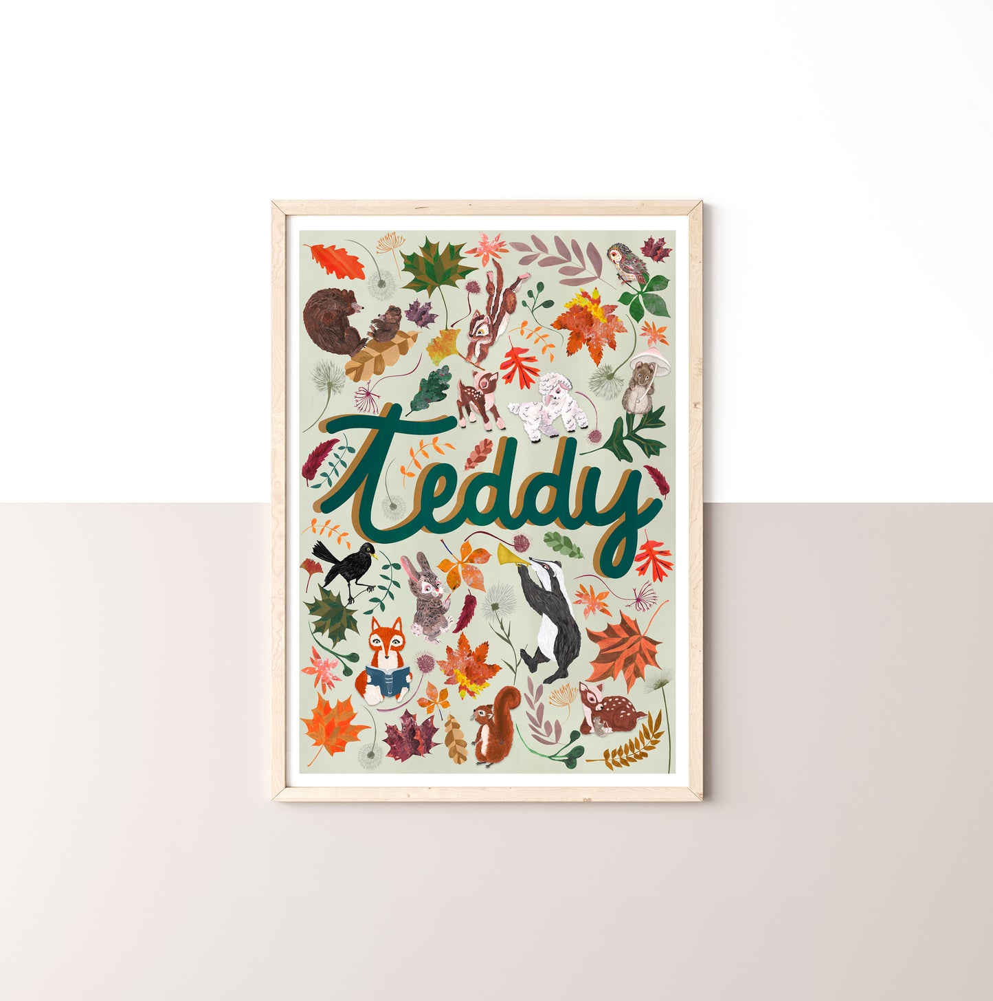 Framed artwork with 'Teddy' and animal illustrations on a white wall
