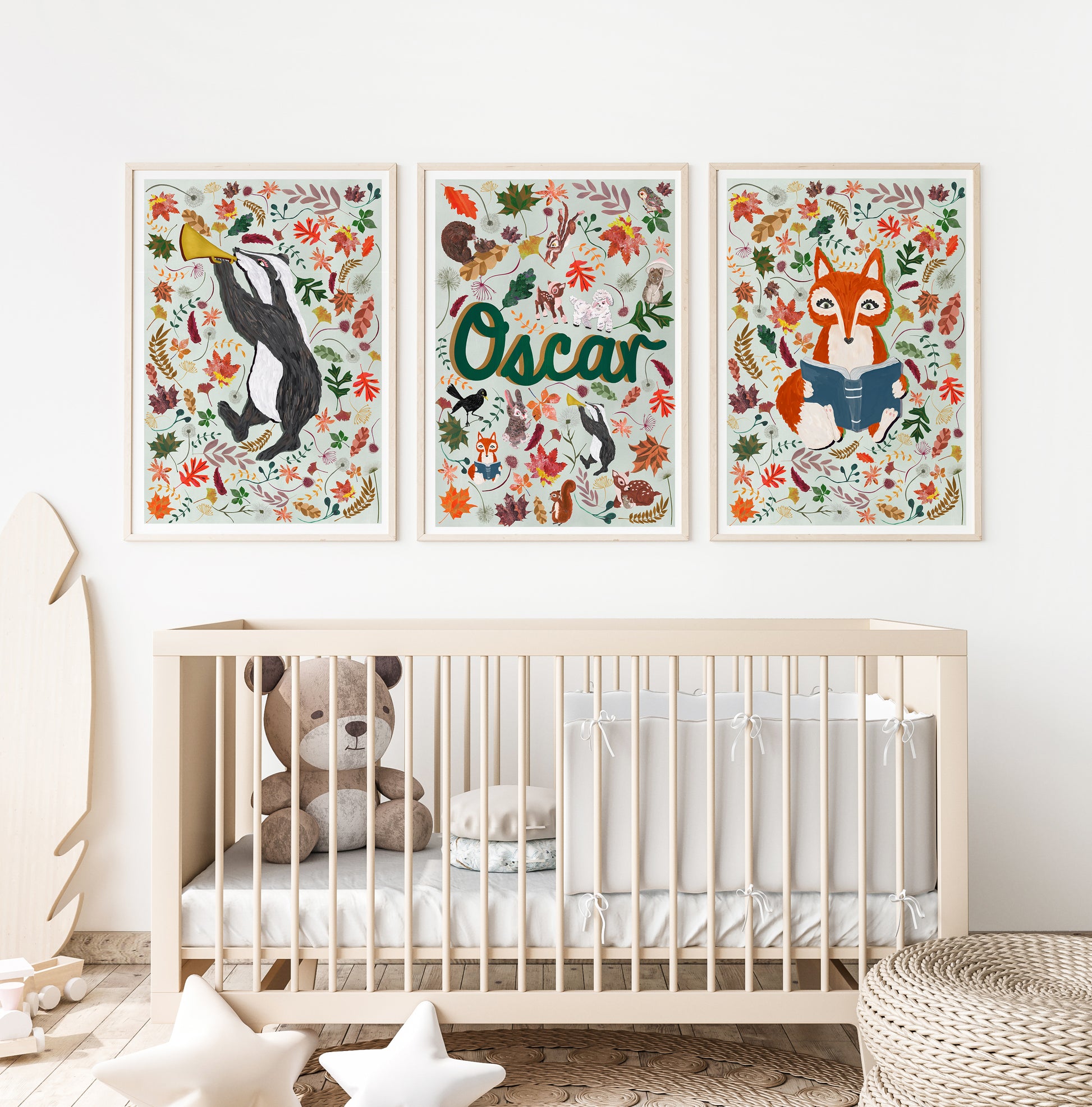Nursery room with a crib, teddy bear, and wall art featuring woodland animals and the name 'Oscar'.